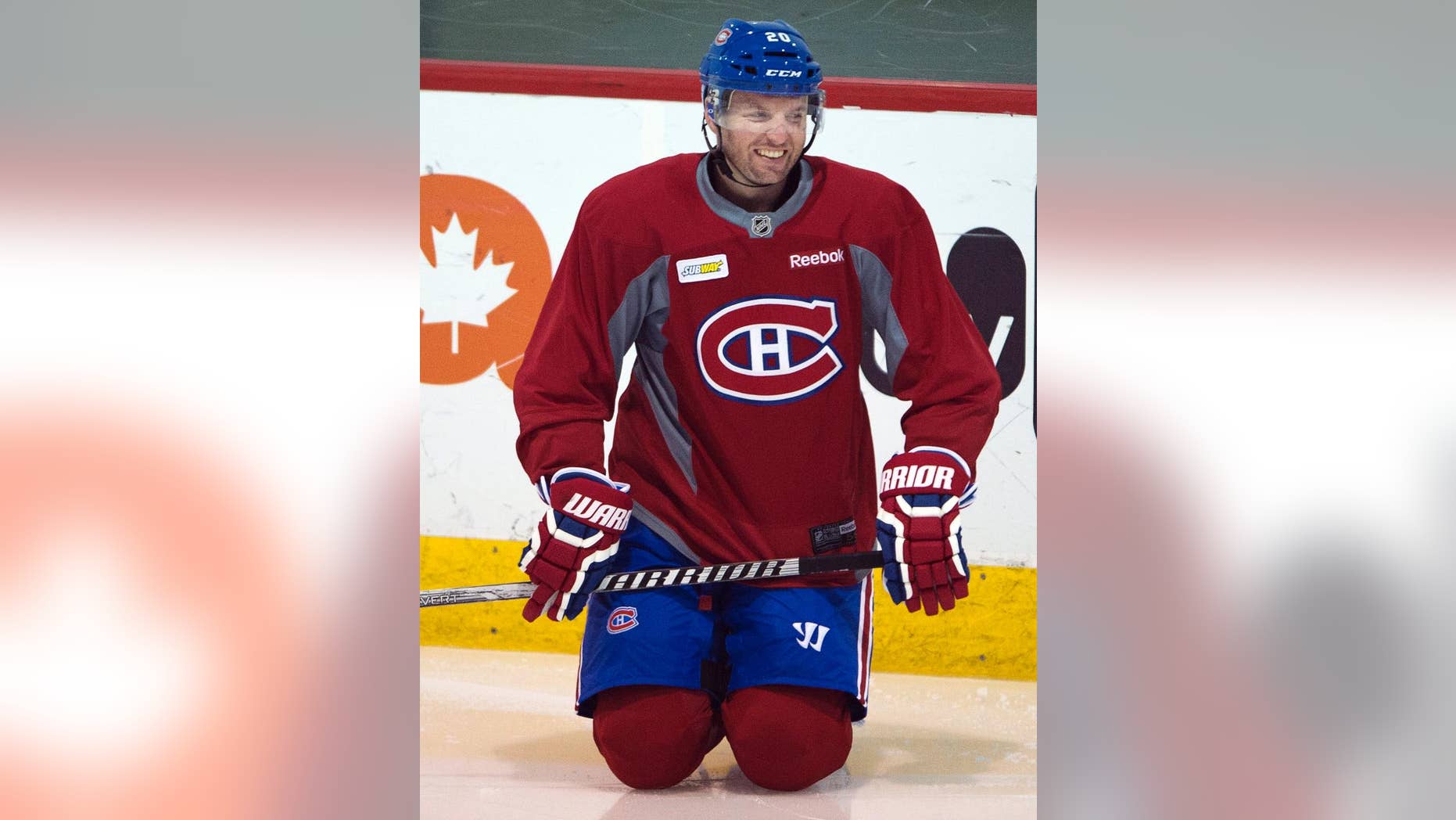 FILE - In this April 14, 2014 file photo, Montreal Canadiens left wing Thomas Vanek stretches during the team's hockey practice in Brossard, Quebec. NHL teams can begin making deals with free agents Tuesday, July 1, 2014. (AP Photo/The Canadian Press, Ryan Remiorz, File)