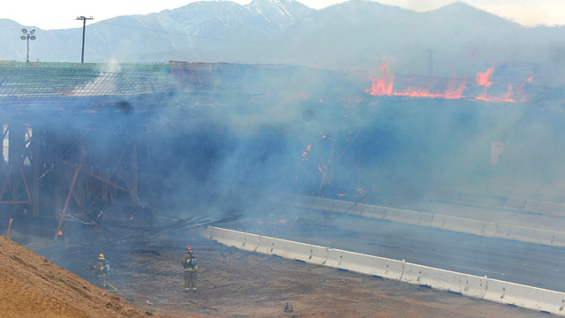 May 5, 2014: The construction site at Interstate 15 was engulfed in flames on in Hesperia, Calif. The California Highway Patrol's Carlos Juarez says the bridge at Ranchero Road caught fire at about 1:30 p.m. and Interstate 15 was closed soon after because of falling debris. (AP Photo/The Victor Valley Daily Press, David Pardo)