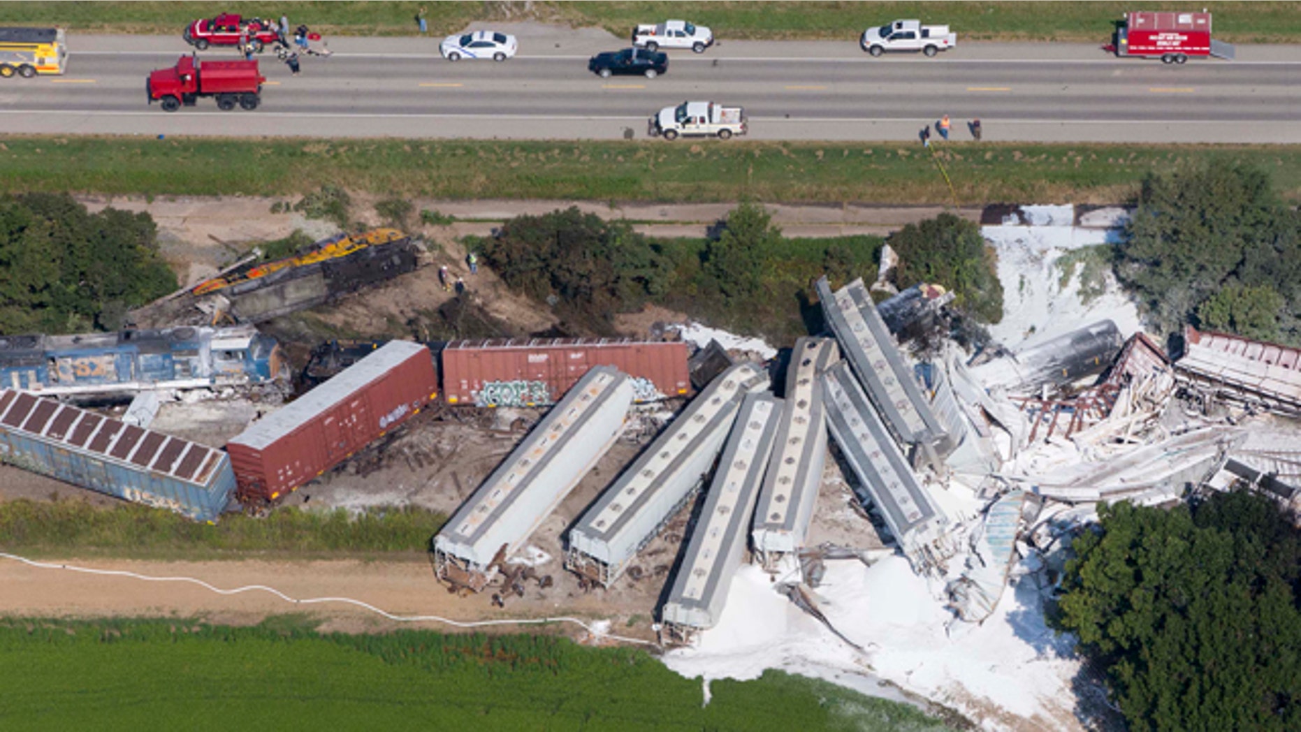 August 17, 2014: Emergency personnel work at the site of a head-on collision of two Union Pacific trains outside of Hoxie, Ark. Arkansas State Police said two Union Pacific train crew members were killed and two others injured in the early morning accident. (AP Photo/Arkansas Democrat-Gazette, Melissa Sue Gerrits)