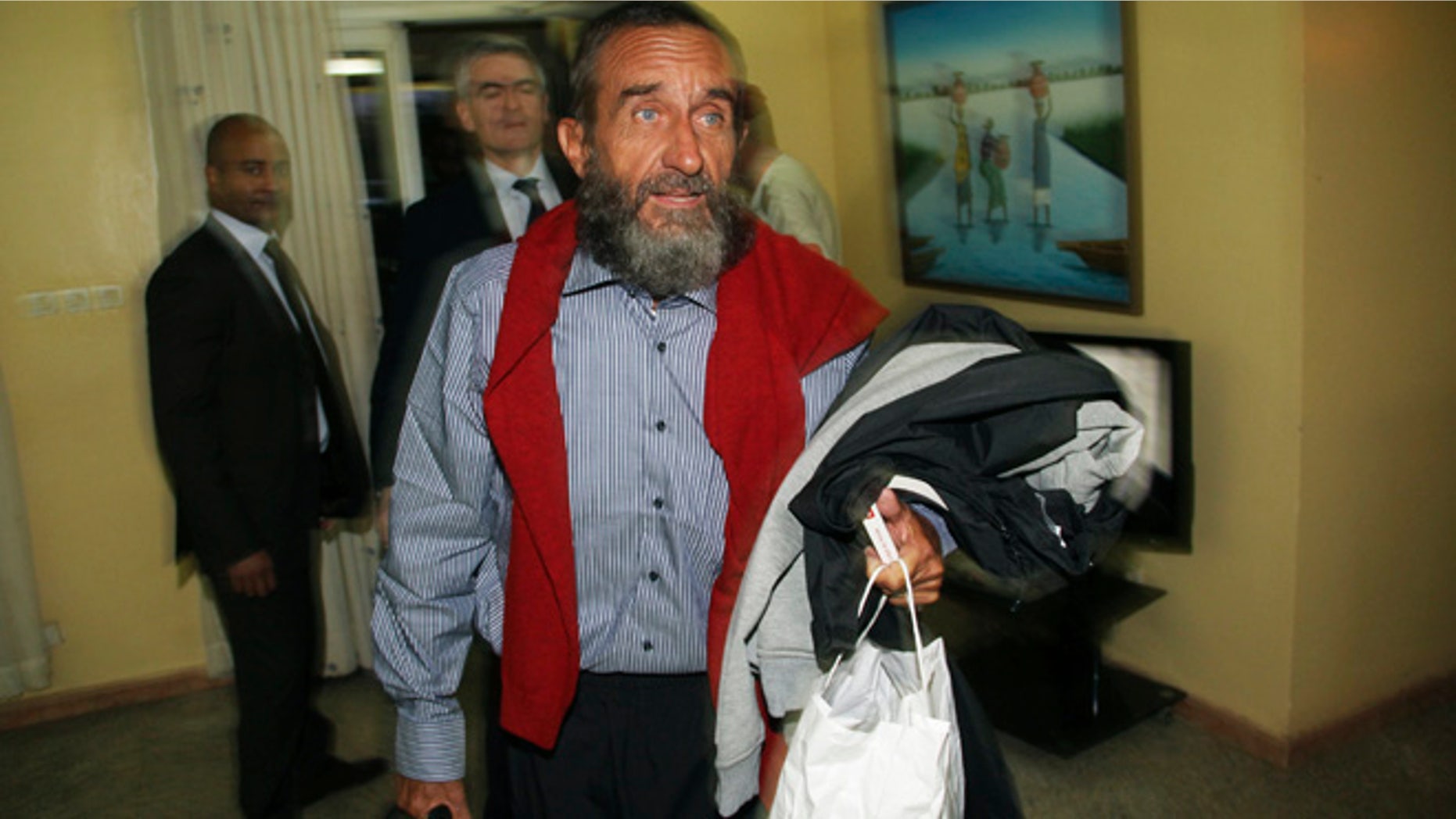 Oct. 30, 2013: Daniel Larribe, one of four Frenchmen held hostage by Al Qaeda militants for three years in the African Sahel, walks at the airport in Niamey, Niger.
