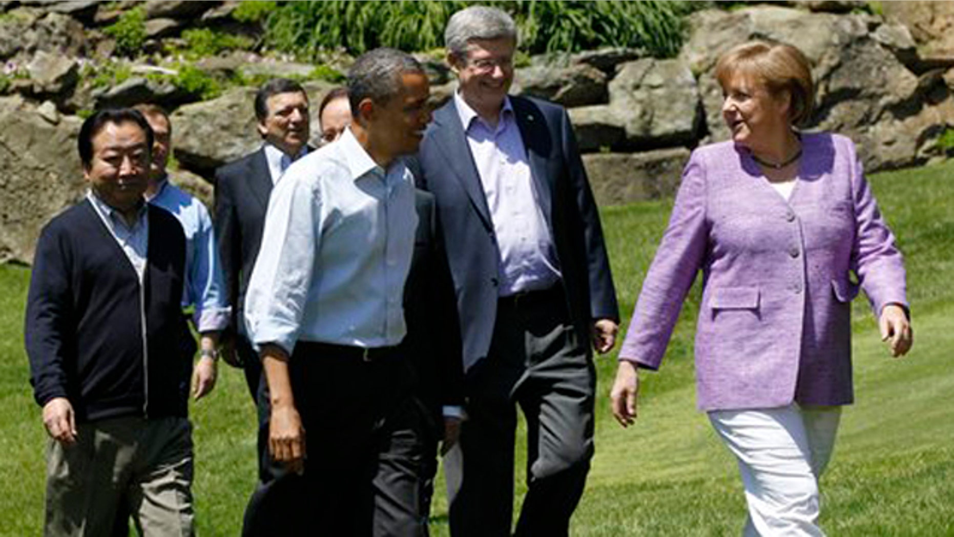May 19, 2012: From left, Japanese Prime Minister Yoshihiko Noda, Russian Prime Minister Dmitry Medvedev, President of the European Commission Jose Manuel Barroso, President Barack Obama, Canadian Prime Minister Stephen Harper and German Chancellor Angela Merkel make their way to a photo opportunity at the G-8 Summit Saturday, at Camp David, Md.