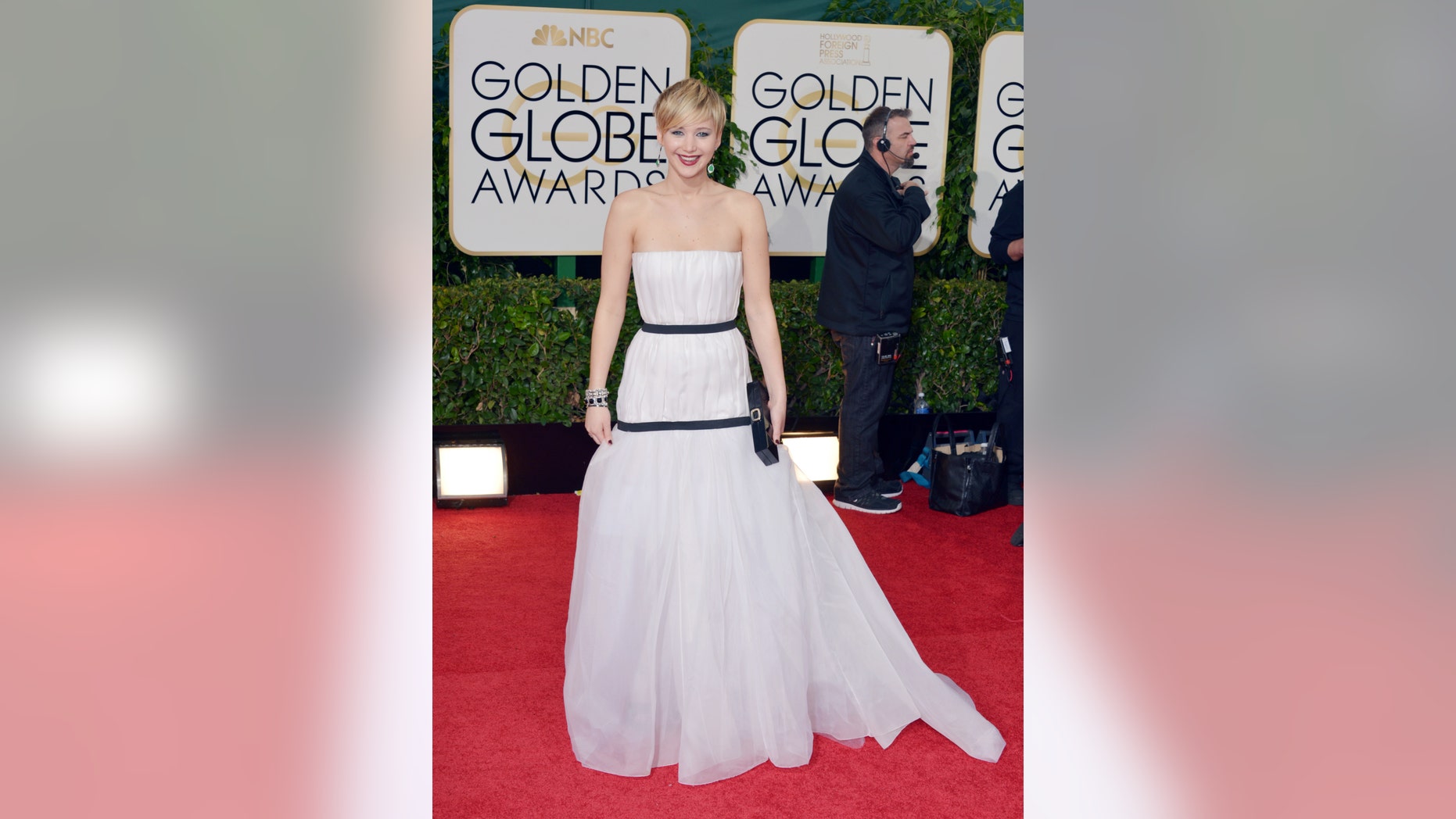 Jennifer Lawrence arrives at the 71st annual Golden Globe Awards at the Beverly Hilton Hotel on Sunday, Jan. 12, 2014, in Beverly Hills, Calif. (Photo by John Shearer/Invision/AP)