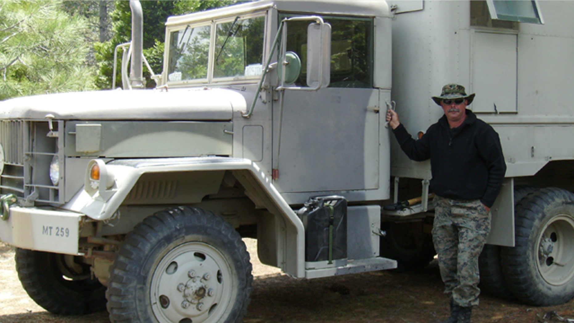 Jim Long and the 1967 A3 shop truck he bought from the government five years ago.