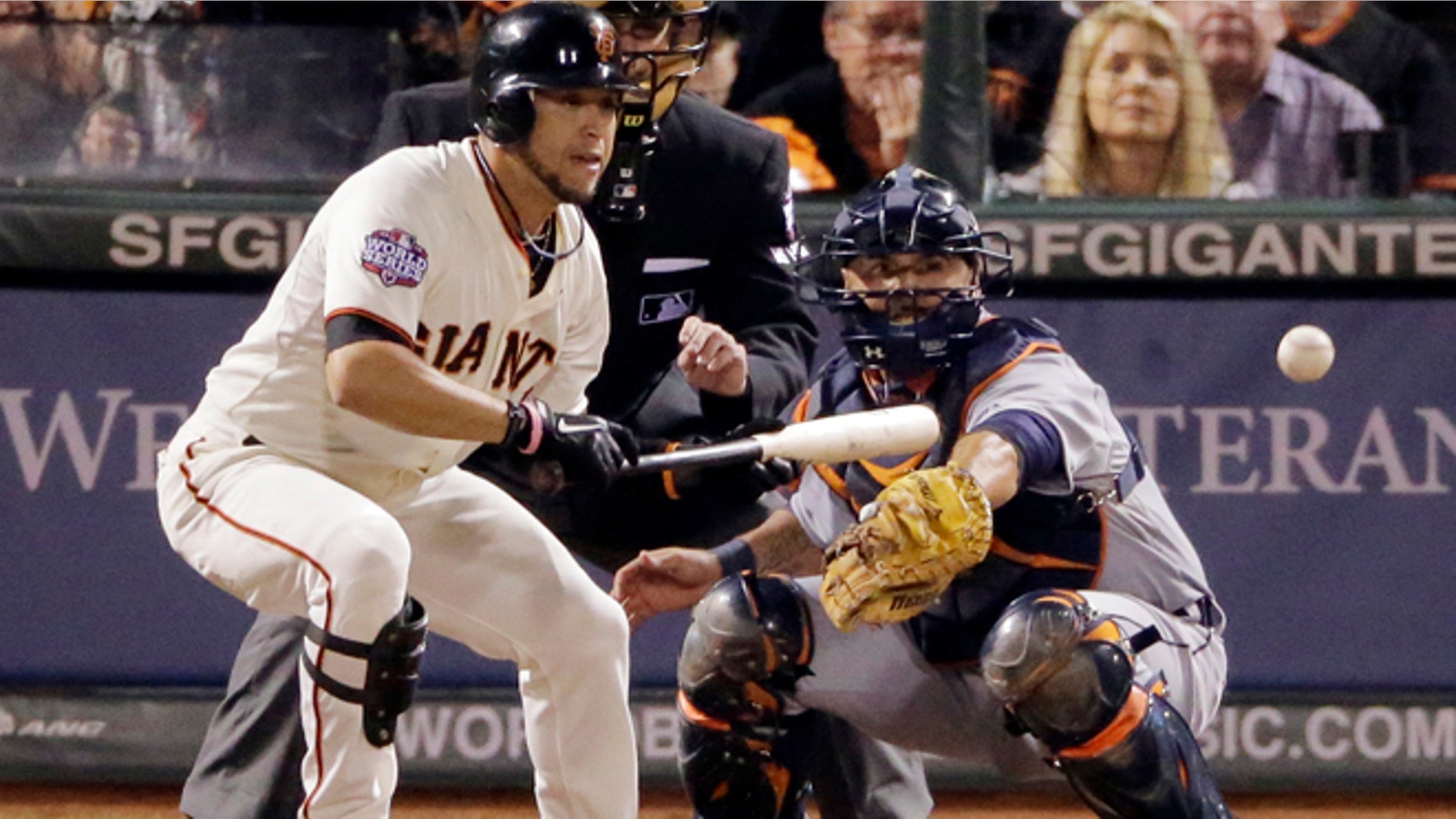 San Francisco Giants' Gregor Blanco bunts to load the bases during the seventh inning of Game 2 of baseball's World Series against the Detroit Tigers, Thursday, Oct. 25, 2012, in San Francisco. (AP Photo/Charlie Riedel)