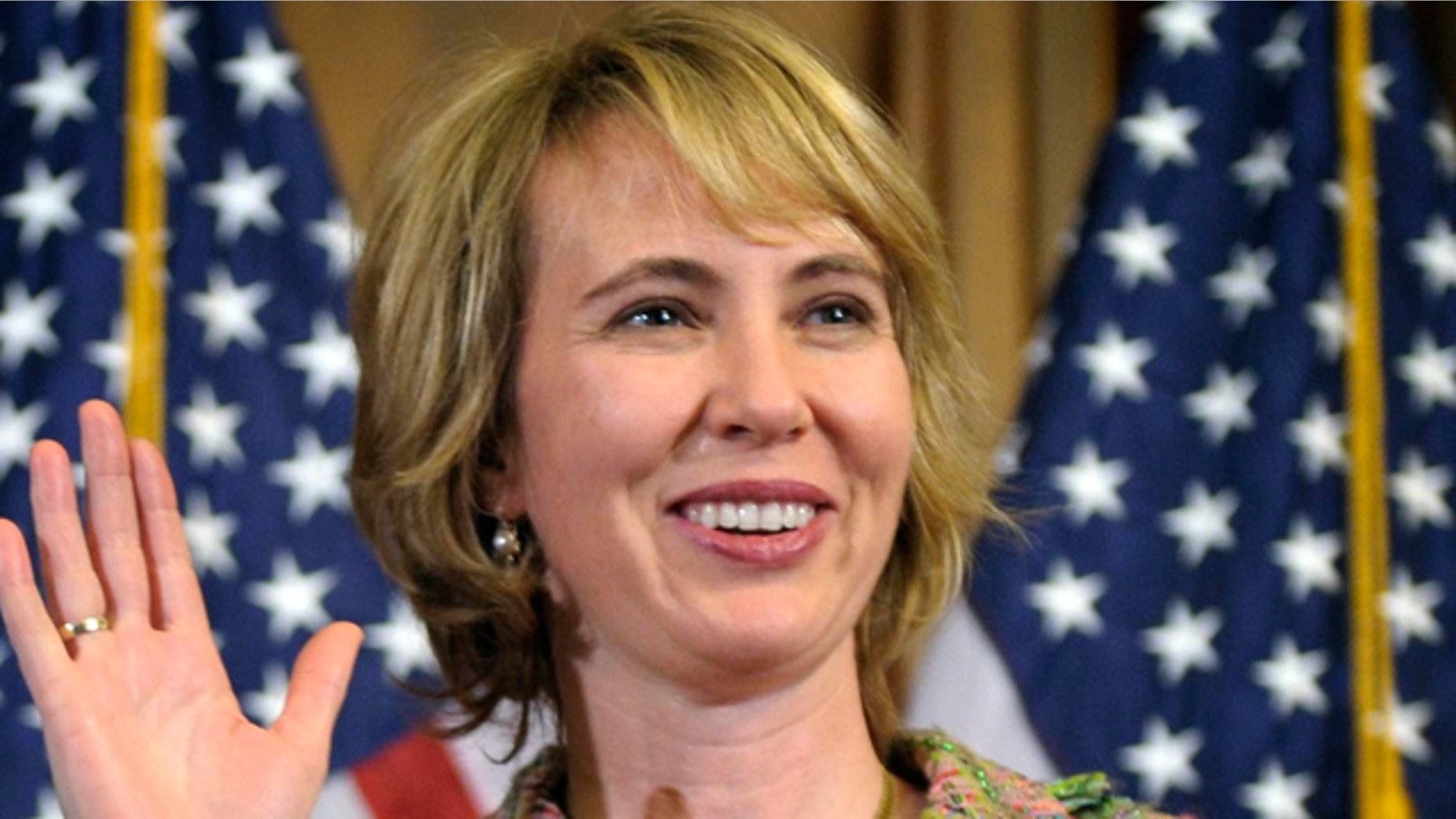 In this Jan. 5, 2011 file photo, Rep. Gabrielle Giffords, D-Ariz., takes part in a reenactment of her swearing-in, on Capitol Hill in Washington.