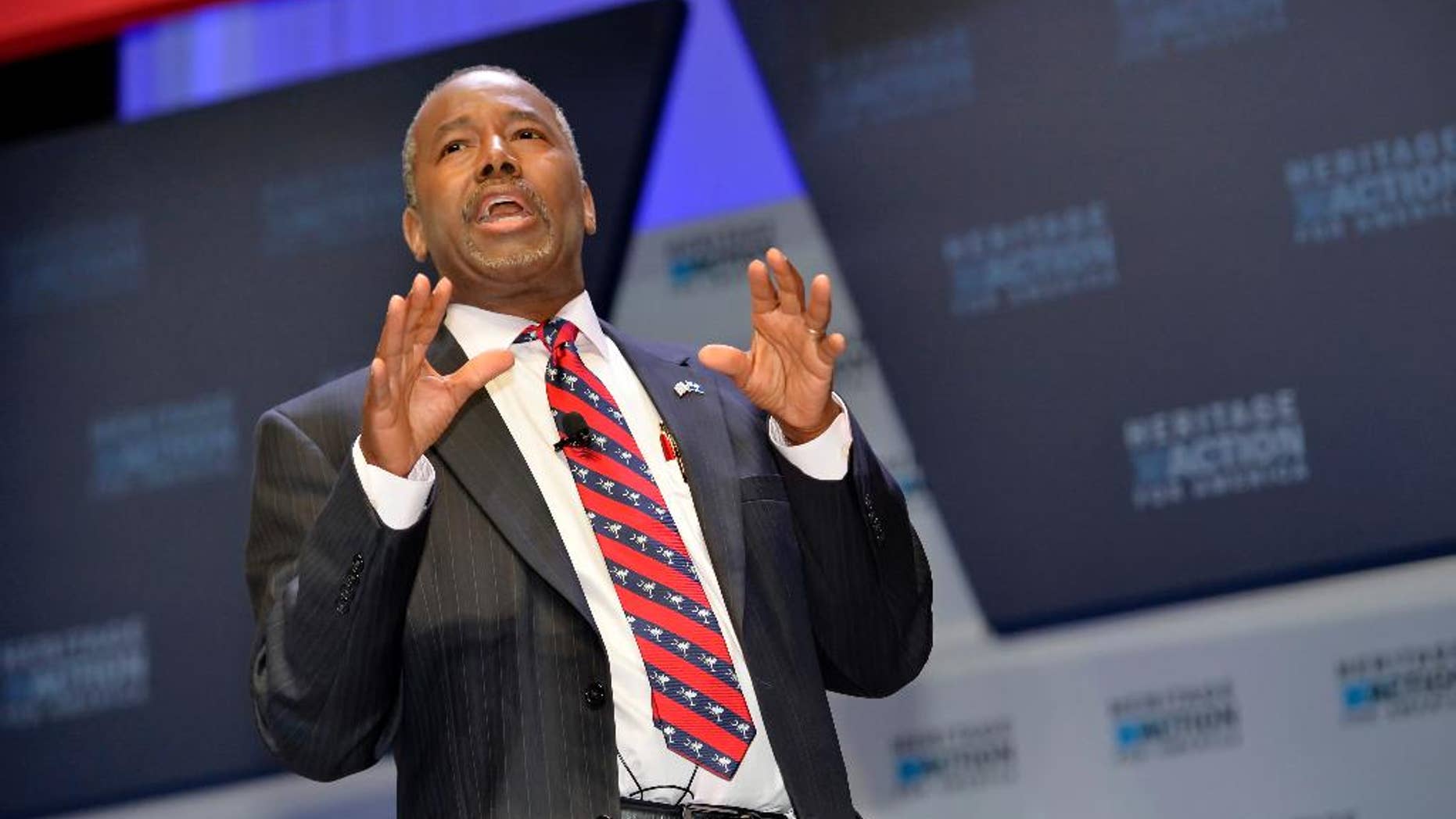 FILE - In this Sept. 18, 215 file photo, Republican presidential candidate Ben Carson speaks in Greenville, S.C. Carson is refusing to back off his weekend charge that Muslims shouldn’t serve in the presidency. (AP Photo/Richard Shiro, File)
