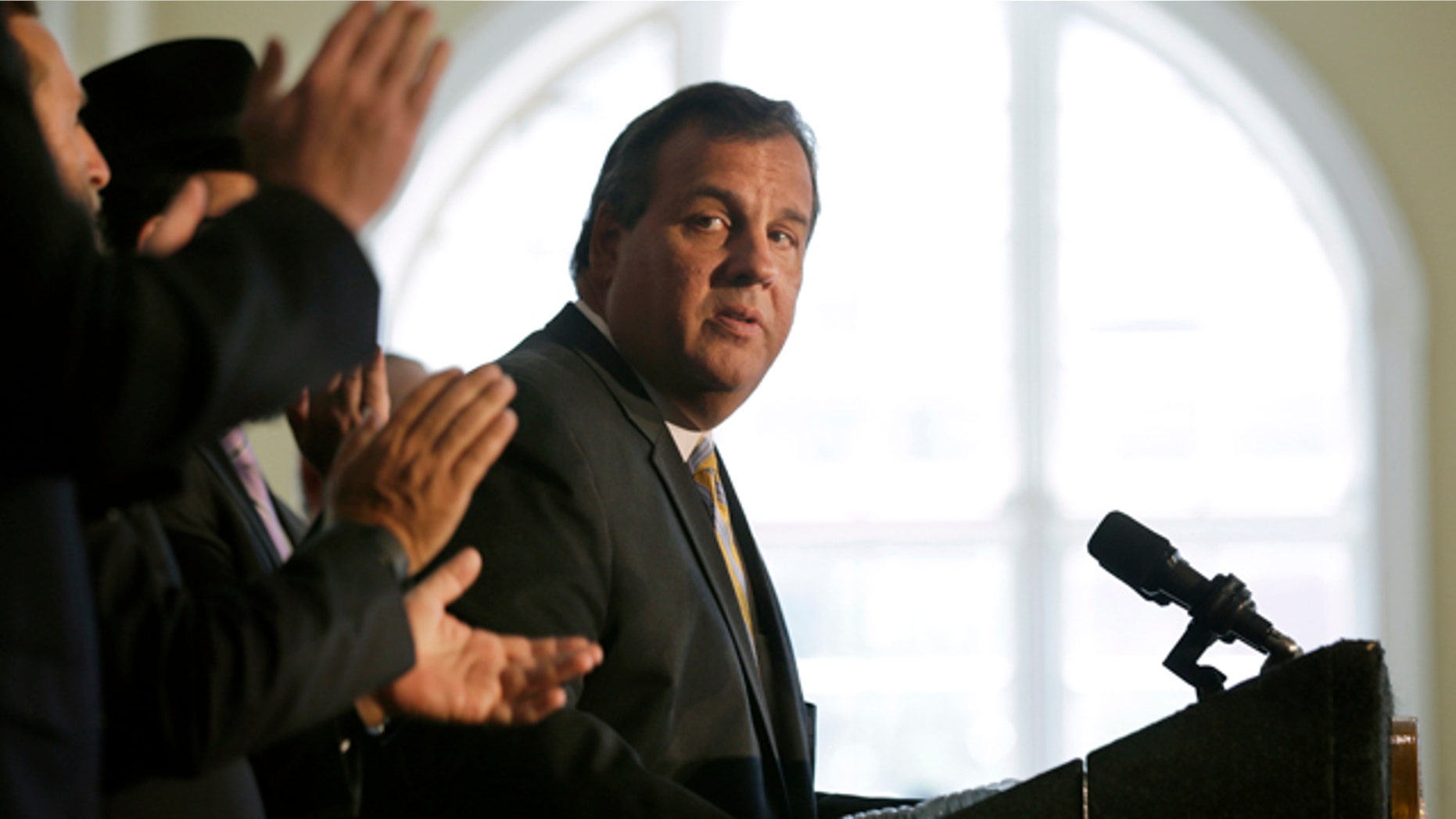 Aug. 25, 2015: New Jersey Gov. Chris Christie listens to applause after he called on Democratic Sen. Cory Booker and the state's congressional delegation to join Sen. Bob Menendez in opposing the Iran nuclear deal at Rutgers University in New Brunswick, N.J. (AP Photo/Mel Evans)