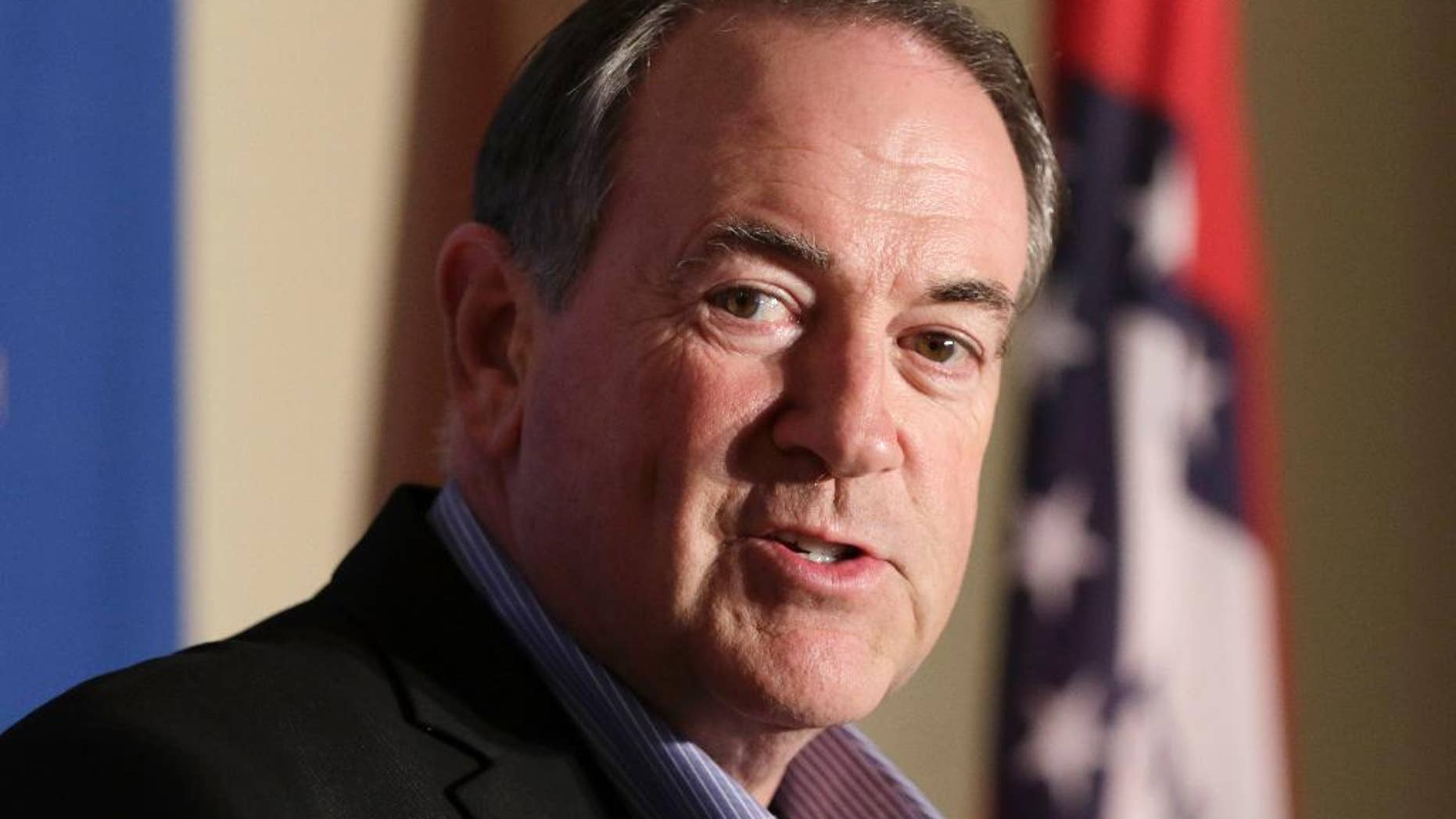 FILE - In this Aug. 24, 2015, file photo, former Arkansas Governor and Republican presidential candidate Mike Huckabee speaks to reporters in Little Rock, Ark. Huckabee is scheduled to visit a Kentucky jail next week to meet with a county clerk imprisoned because she ignored repeated court orders to issue marriage licenses to gay couples. Huckabee, a Baptist pastor, plans to host a rally in county clerk Kim Davis’ honor after the private meeting outside the Carter County Detention Center.(AP Photo/Danny Johnston, File)