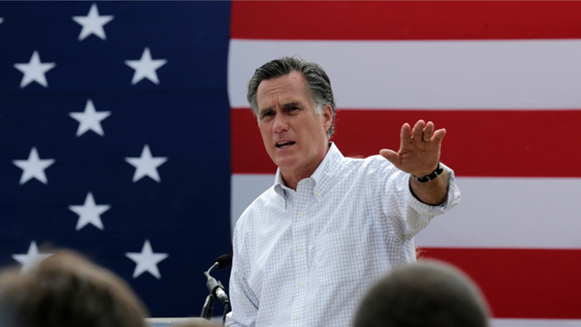 Mitt Romney, the former Republican presidential nominee, addresses a crowd of supporters while introducing New Hampshire Senate candidate Scott Brown at a farm in Stratham, N.H.