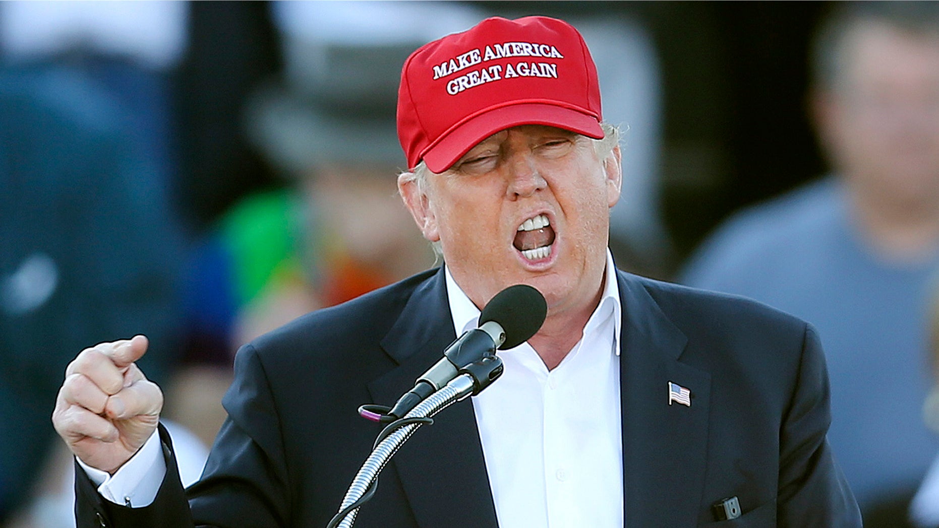FILE - In this Feb. 28, 2016, file photo, Republican presidential candidate Donald Trump speaks during a rally in Madison, Ala. Republican presidential front-runner Trump has staked out uncompromising positions on Asia policy that could potentially strain U.S. relations with the region if he wins the White House. He says China is ripping off America in trade and should be slapped with a fat import tax. And he claims U.S. military allies Japan and South Korea are freeloading and need to pull their weight. The pan-Pacific trade pact negotiated by the Obama administration is a "total disaster." (AP Photo/John Bazemore, File)