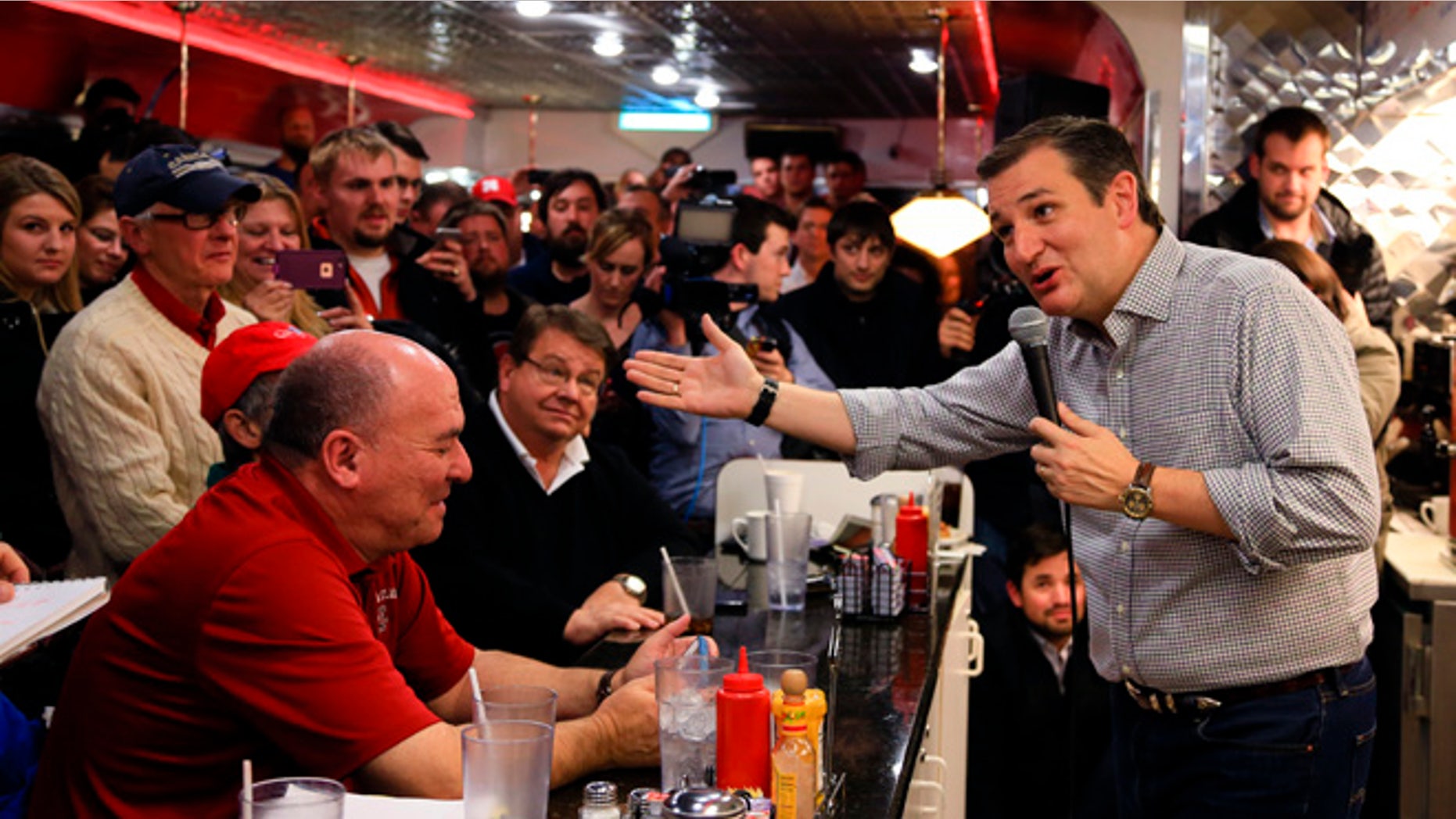 FILE - In this Jan 4, 2016 file photo, Republican Presidential candidate, Sen. Ted Cruz, R-Texas, campaigns at Penny's Diner in Missouri Valley, Iowa. Cruz and Marco Rubio are fighting for the favor of many of the same undecided voters across Iowa, where even some of the most attentive Republicans say they canât make up their minds less than four weeks before voting begins. (AP Photo/Nati Harnik, File)