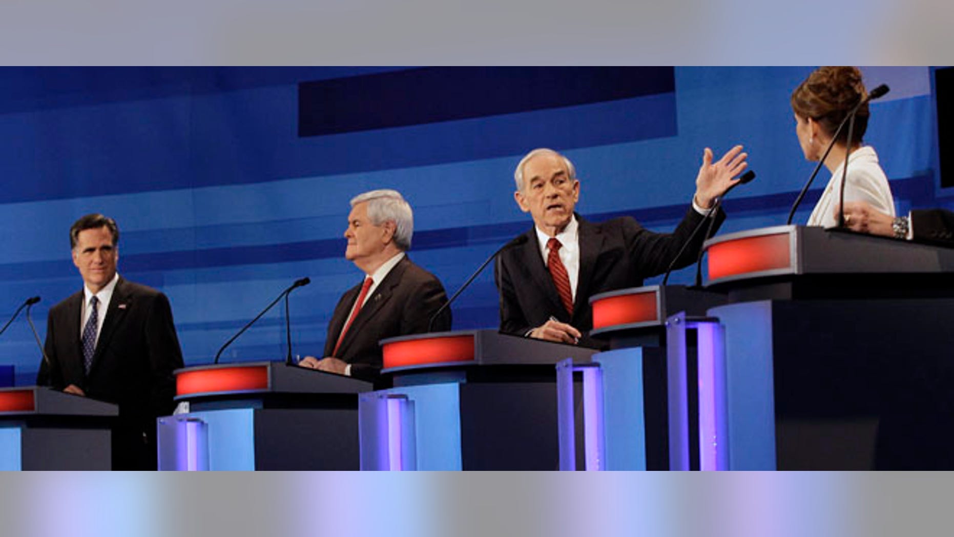 Republican presidential candidates from left, former Massachusetts Gov. Mitt Romney, former House Speaker Newt Gingrich, Rep. Ron Paul, R-Texas, and Rep. Michele Bachmann, R-Minn., participate in a Republican presidential debate in Sioux City, Iowa, Thursday, Dec. 15, 2011. (AP Photo/Eric Gay, Pool)