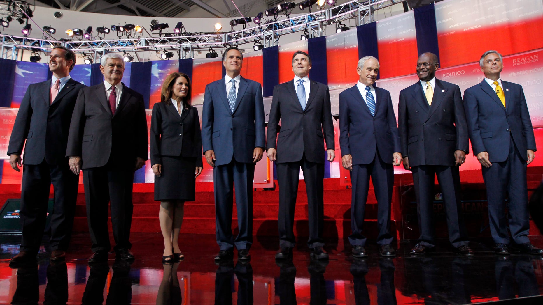 In this Sept. 7, 2011, file photo Republican presidential candidates stand together before a Republican presidential candidate debate at the Reagan Library in Simi Valley, Calif.