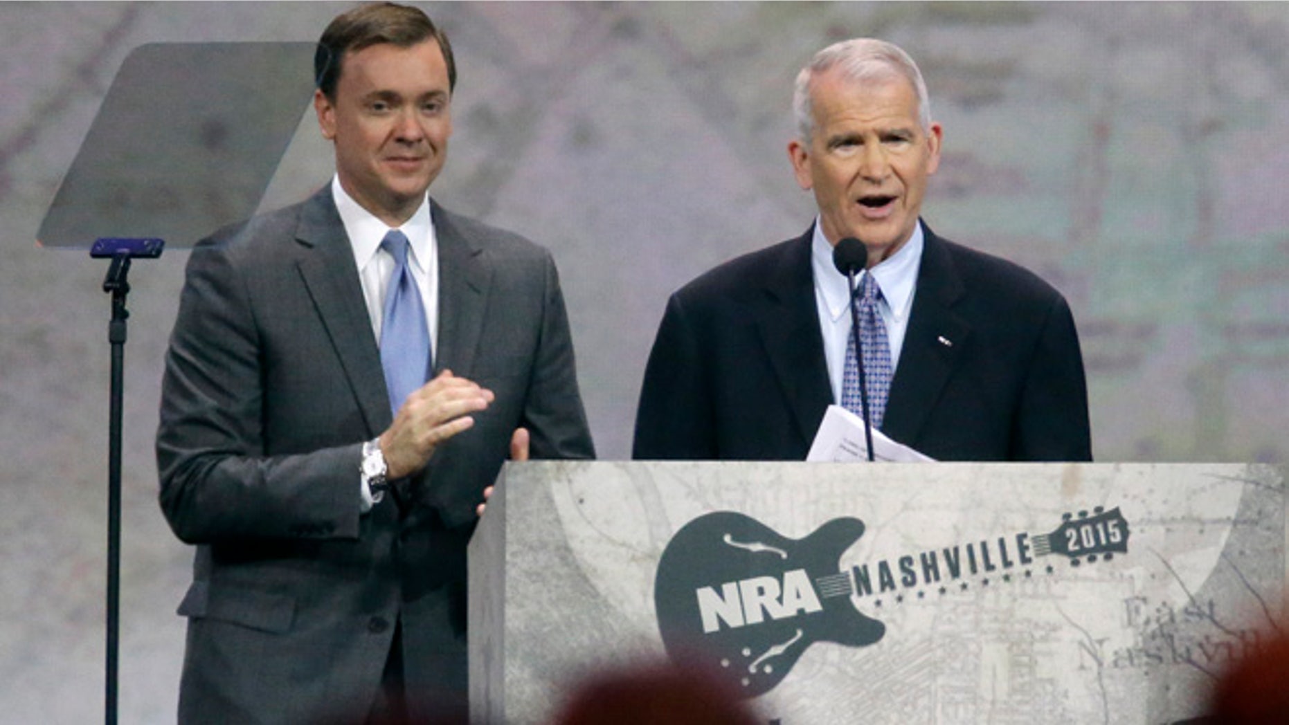 April 10, 2015: Retired Marine Lt. Col. Oliver North, right, speaks at the National Rifle Association convention in Nashville, Tenn.
