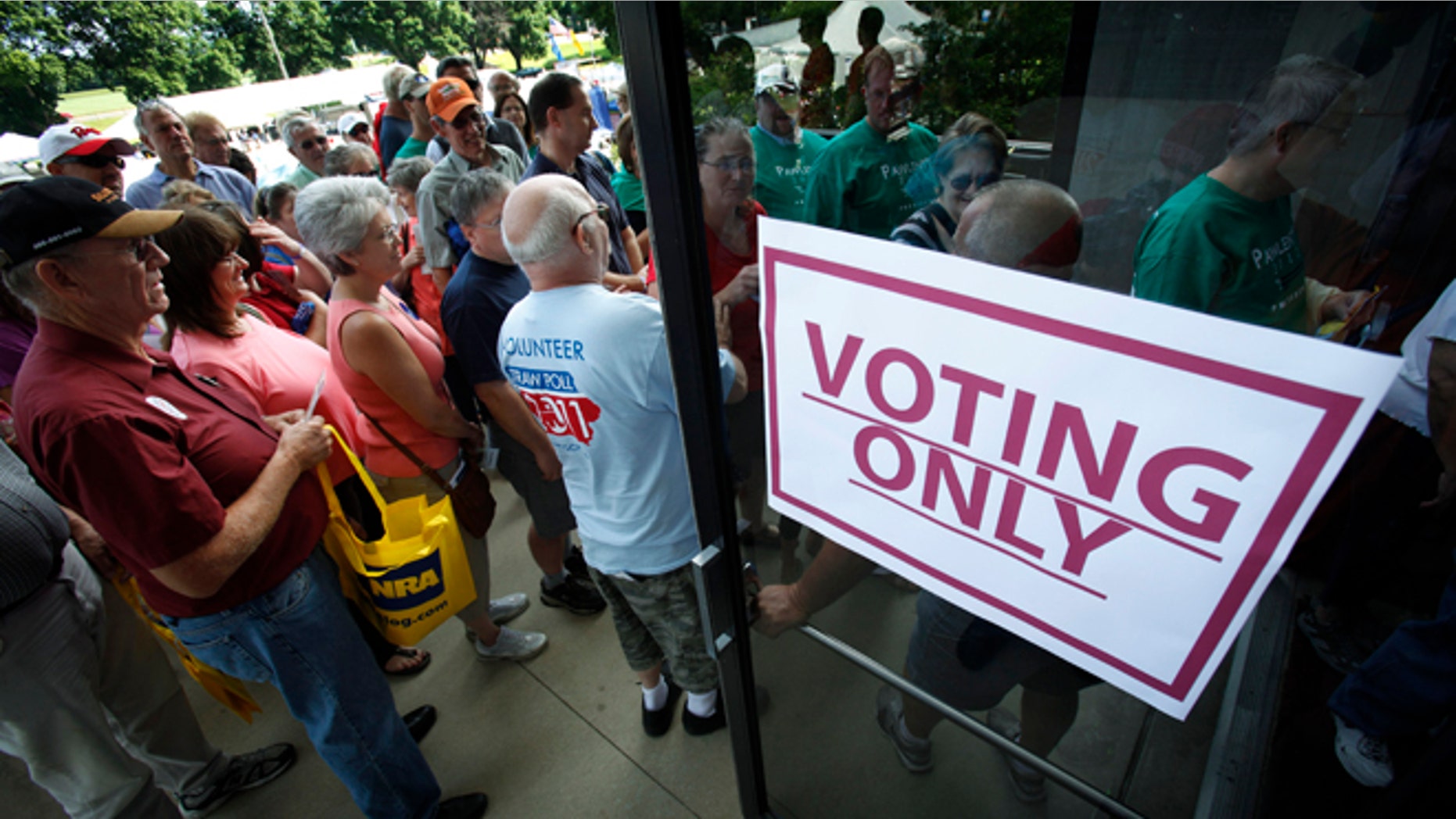 Aug. 13, 2011: Republicans enter Hilton Coliseum in Ames, Iowa, before casting their ballots in the Iowa Republican Party's straw poll.
