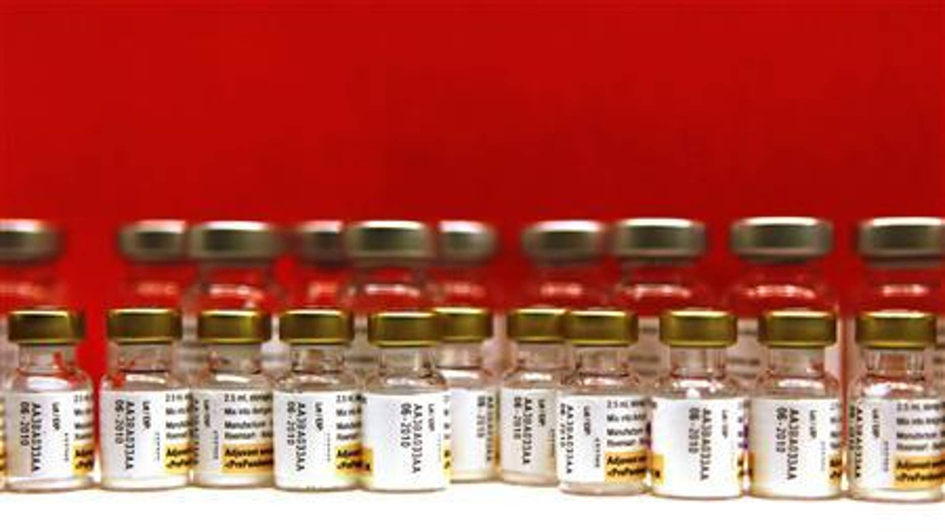 Bottles of adjuvants for use with the Pandemrix H1N1 flu vaccine are seen lined up during a vaccination programme in Schiedam in this November 23, 2009 file photo. REUTERS/Jerry Lampen/Files
