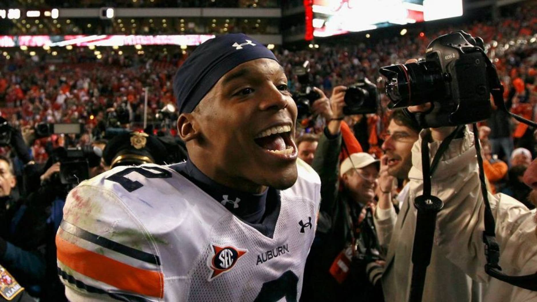 TUSCALOOSA, AL - NOVEMBER 26: Quarterback Cam Newton #2 of the Auburn Tigers celebrates their 28-27 win over the Alabama Crimson Tide at Bryant-Denny Stadium on November 26, 2010 in Tuscaloosa, Alabama. (Photo by Kevin C. Cox/Getty Images)