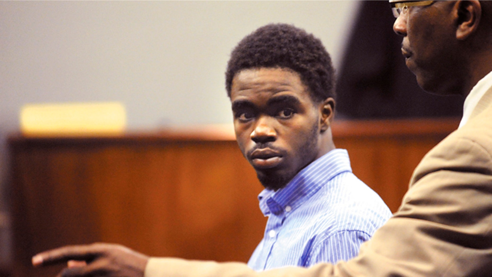 March 25, 2013: A Glynn County Sheriff's Deputy directs 17 year-old De Marquise Elkins out of the courtroom in the Glynn County Courthouse in Brunswick, Ga. after Elkin's first appearance hearing in Magistrate Court.