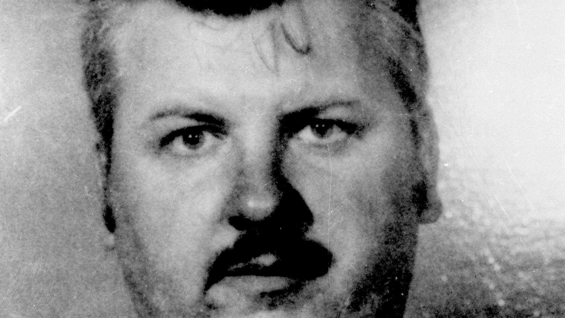 1978: This file photo shows serial killer John Wayne Gacy. Detectives who have long wondered if Gacy killed others besides the 33 young men he was convicted of murdering may soon get to search for bodies underneath an apartment complex where his late mother once lived, a law enforcement official said.