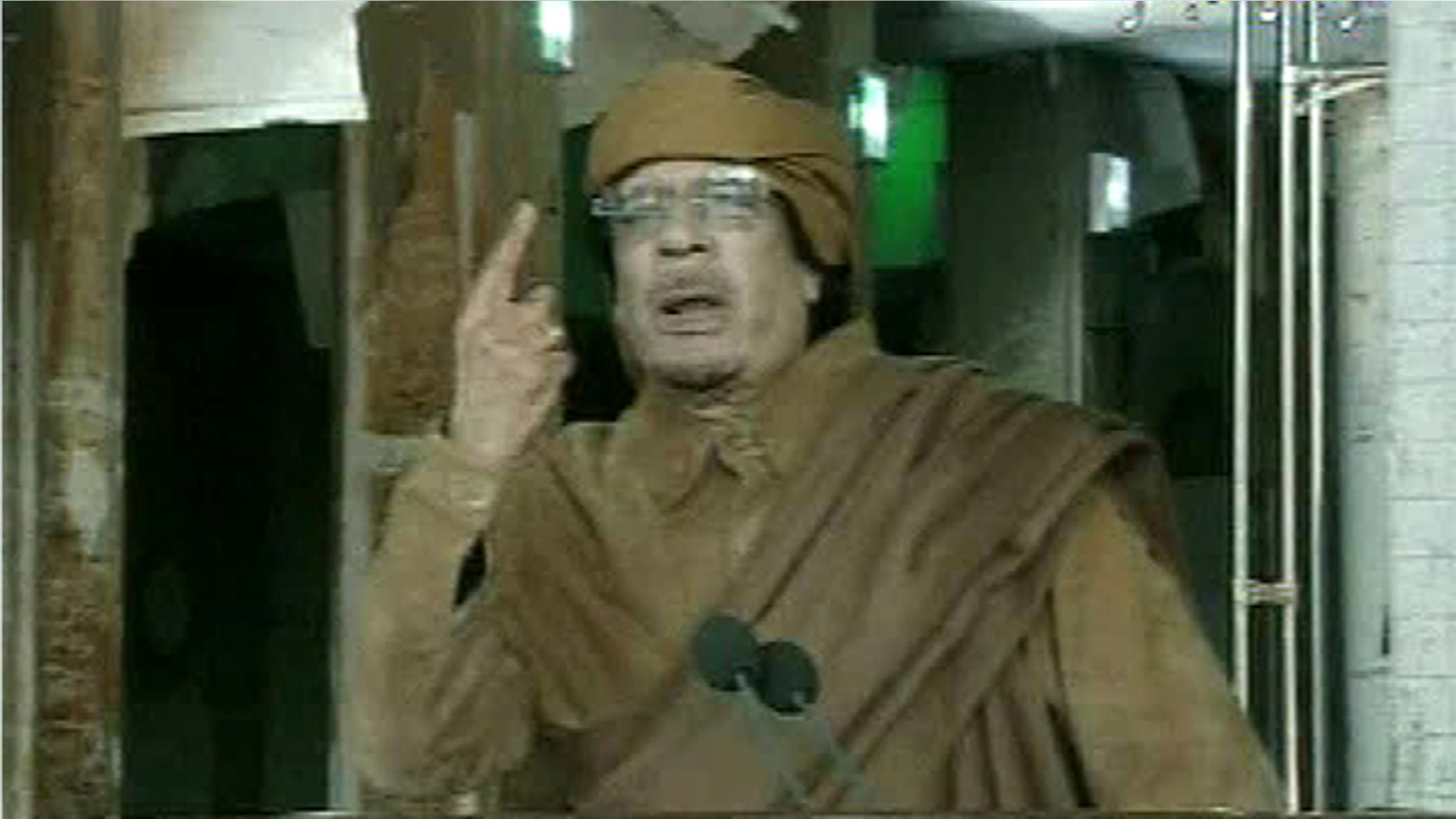 Feb. 22, 2011: This image broadcast on Libyan state television shows Libyan leader Muammar al-Qaddafi as he addresses the nation in Tripoli, Libya.
