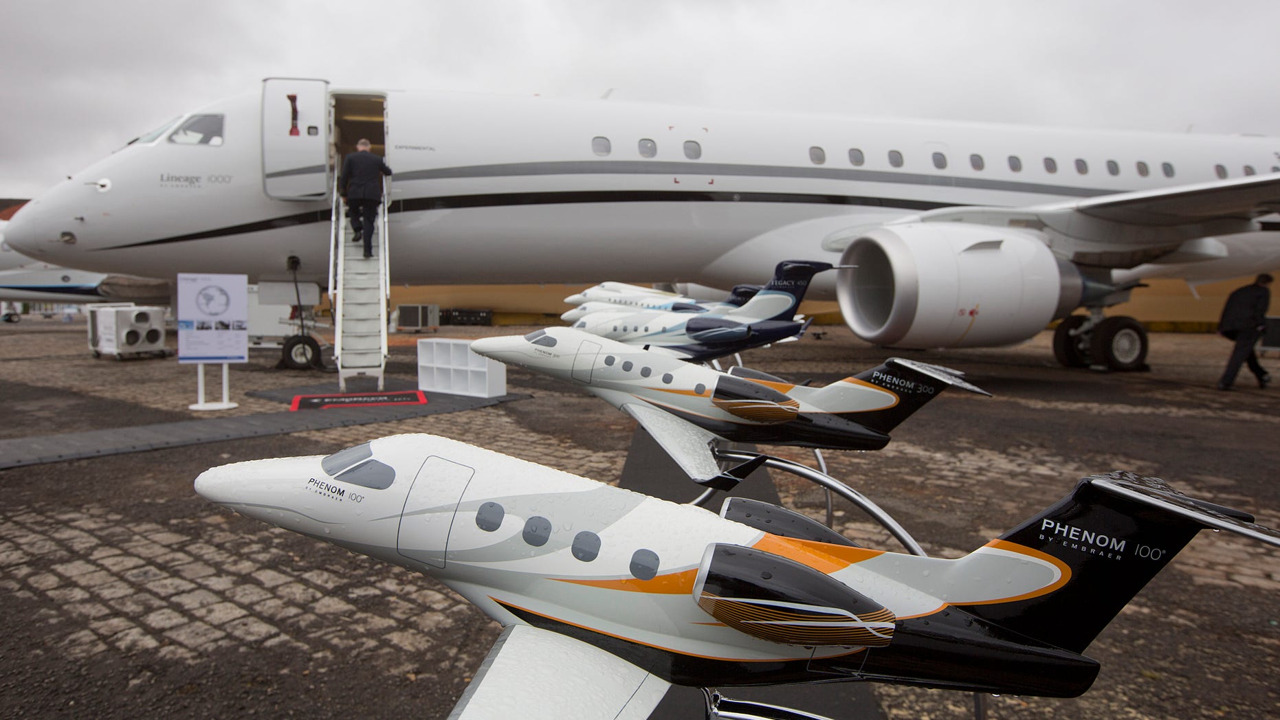 FILE - In this Aug. 16, 2012 file photo, Miniature models of planes by Brazilian aerospace giant Embraer sit on display at the Latin American Business Aviation Conference and Exhibition (LABACE) 2012 annual meeting at the Congonhas airport in Sao Paulo, Brazil. Gary Spulak, president of the U.S. subsidiary of Embraer, predicts that the U.S. will account for more than 50 percent of global demand for aircraft over the next 10 years. (AP Photo/Andre Penner, File)