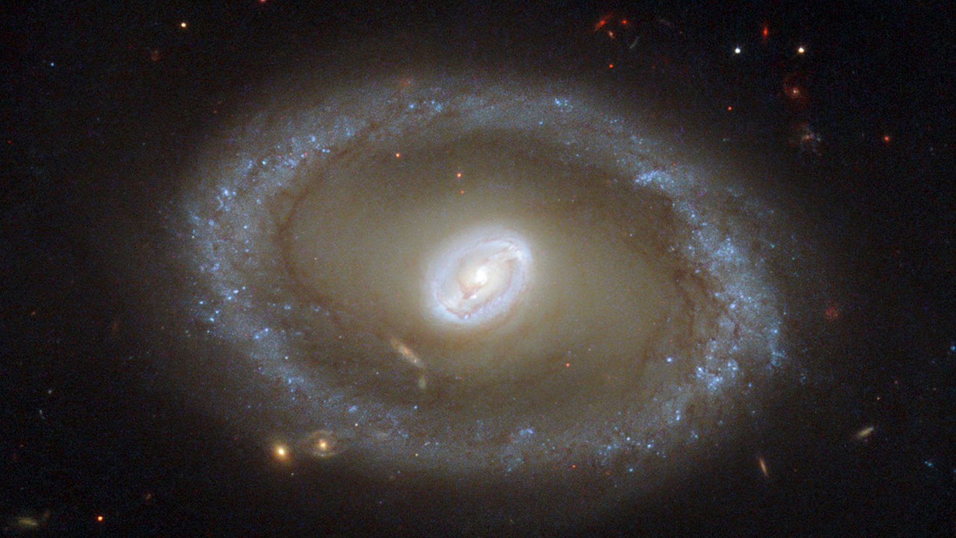 A galaxy known as NGC 3081 located over 86 million light-years from Earth is seen in an undated NASA/ESA Hubble Space Telescope image.