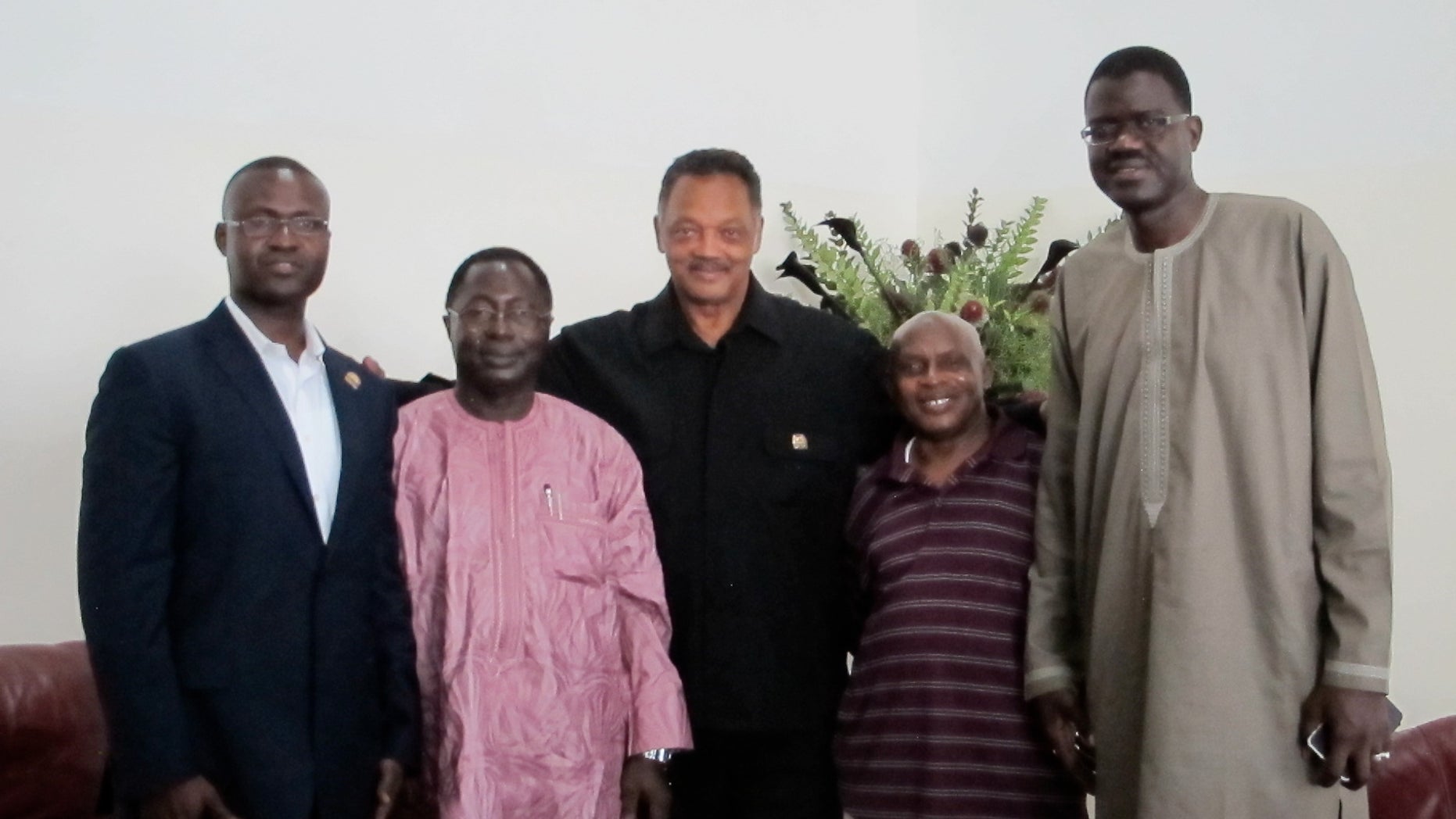 Rev. Jesse Jackson, Sr. pictured with Gambian officials.