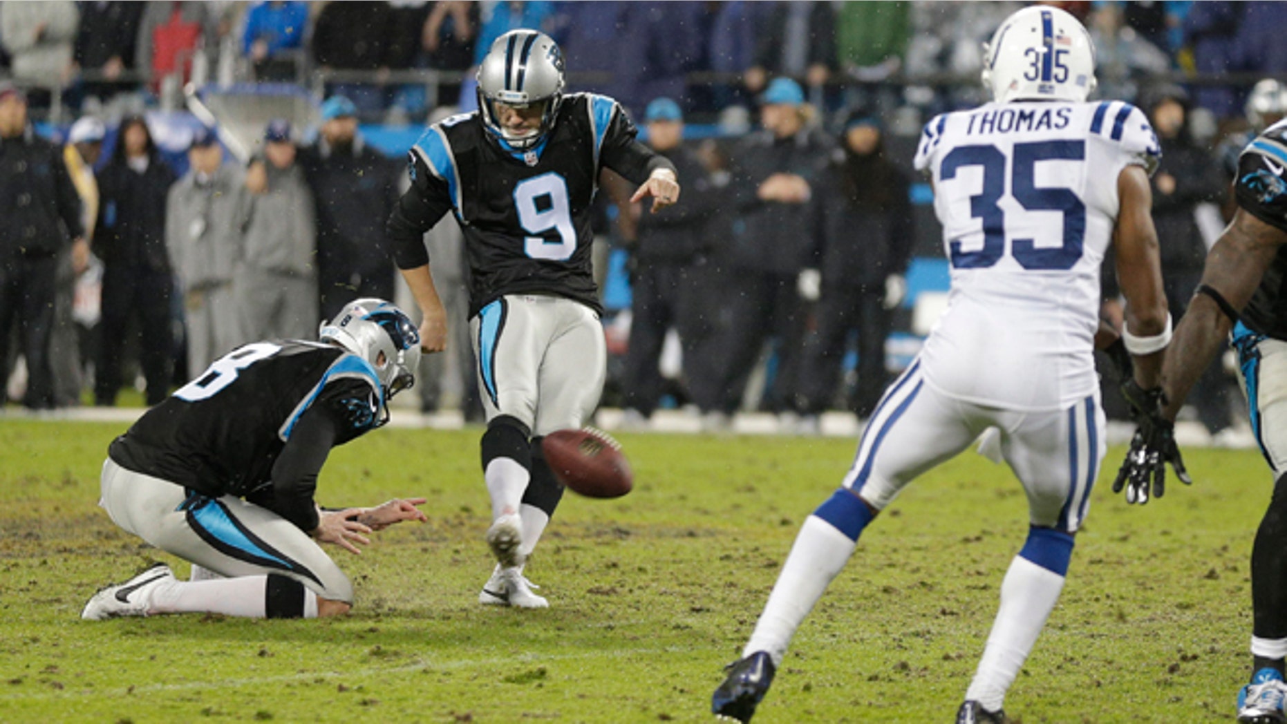 Carolina Panthers' Graham Gano (9) kicks the game-winning field goal in overtime against the Indianapolis Colts in an NFL football game in Charlotte, N.C., early Tuesday, Nov. 3, 2015. The Panthers won 29-26. (AP Photo/Chuck Burton)