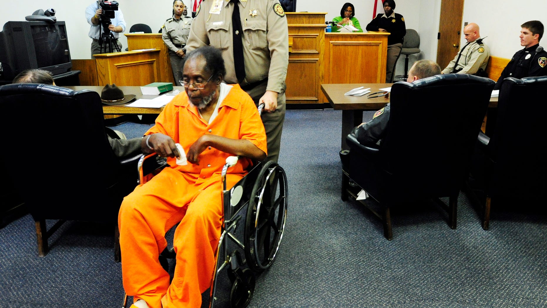 Dec. 4, 2012: Frank Louis Reeves is wheeled out of the courtroom after his first appearance in Macon Ga. No bond was set Wednesday afternoon, Dec. 5, 2012, for Reeves who is accused in the death of a woman outside a Gray Highway gas station after his motorized wheelchair bumped her car.