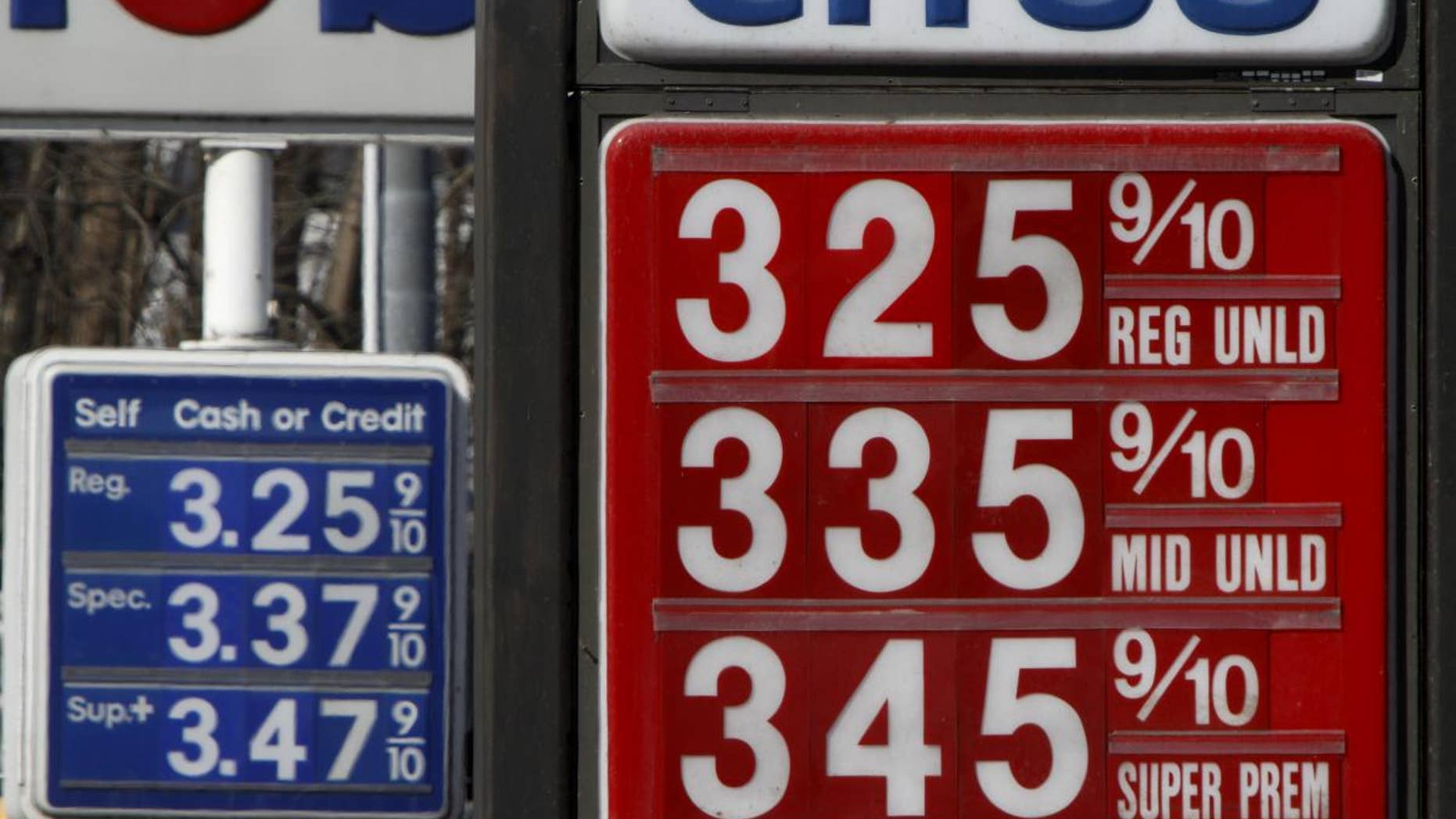 Gas prices are seen on Wednesday, Feb. 23, 2011 in Montpelier, Vt. Gasoline prices jumped 8.2 cents per gallon in the last month, and $1.28 per gallon in the last year. The national average for a gallon of regular on Wednesday added another 2.3 cents at $3.194, according to AAA, Wright Express and Oil Price Information Service. (AP Photo/Toby Talbot)