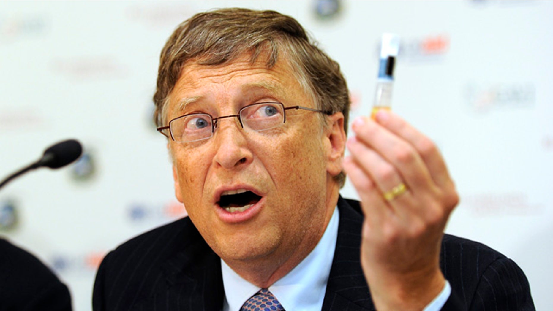 Billionaire philanthropist Bill Gates holda up a Rotavirus vaccine during a news conference at the Global Alliance for Vaccines and Immunisation (GAVI) conference in London June 13, 2011. Britain and Gates pledged $2.3 billion at an international donor conference on Monday to fund vaccination programmes to protect children in poor countries against diseases like pneumonia.