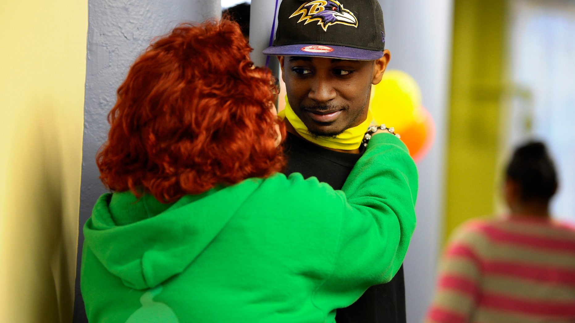 April 19, 2013: Quincy Wright, right, is hugged by a friend during a breaking the silence gathering at True Colors in Hartford, Conn.