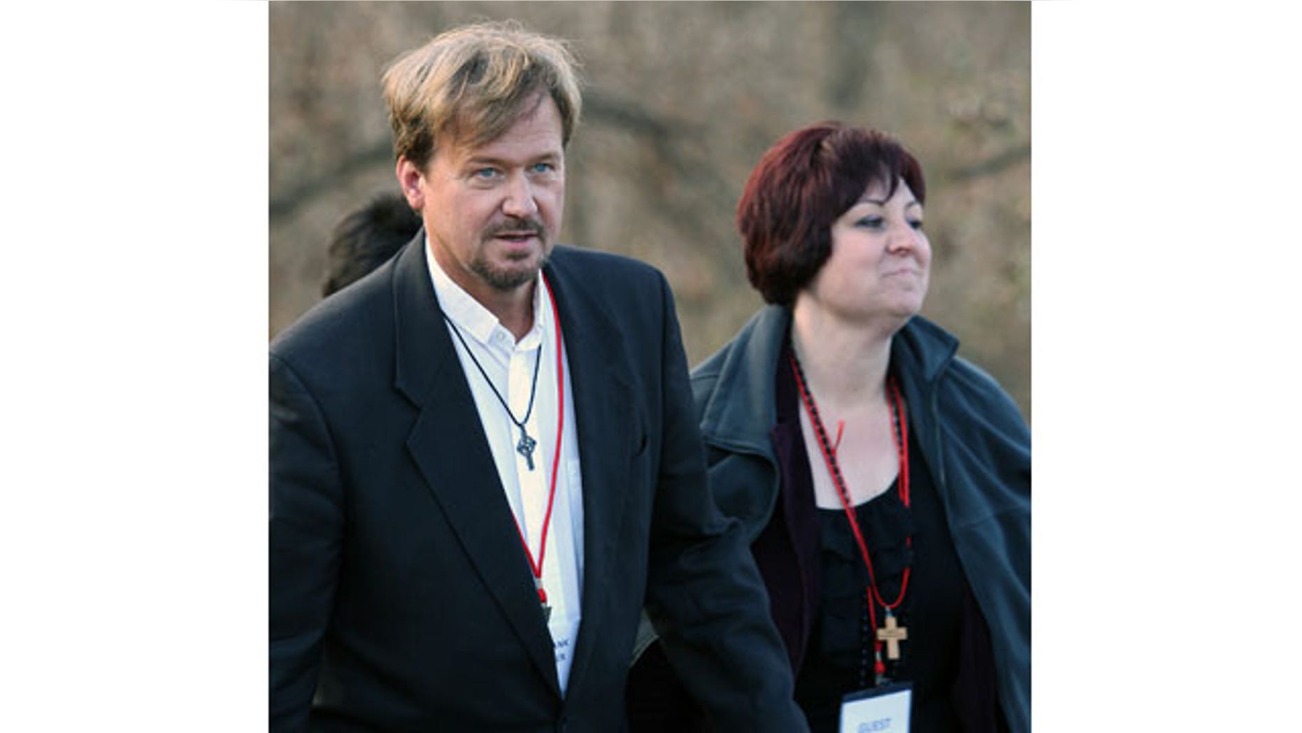 November 19. 2013: The Rev. Frank Schaefer, left, of Lebanon Pa., and his Pastoral Assistant Clydette Overturf, comes back to the trial after a lunch break at Camp Innabah, a United Methodist retreat, in Spring City Pa. A jury of his pastoral peers convicted Schaefer on Monday of breaking his vows by officiating his gay sons' Massachusetts wedding in 2007. (AP Photo)