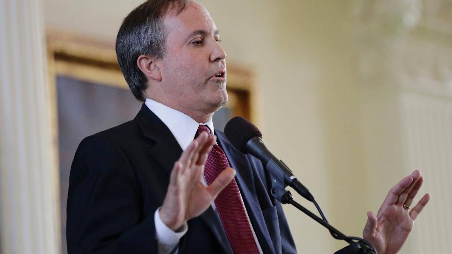 FILE - In this Jan. 5, 2015, file photio, Ken Paxton speaks after he was sworn in as Texas attorney general in Austin, Texas. Paxton calls the Supreme Court decision giving same-sex couples the right to marry a "lawless ruling" and says state workers can cite their religious objections in denying marriage licenses. He warned in a statement Sunday, June 28, 2015, that any clerk, justice of the peace or other administrator who declines to issue a license to a same-sex couple could face litigation or a fine. But in the nonbinding legal opinion, Paxton says "numerous lawyers" stand ready to defend, free of charge, any public official refusing to grant one. (AP Photo/Eric Gay, File)