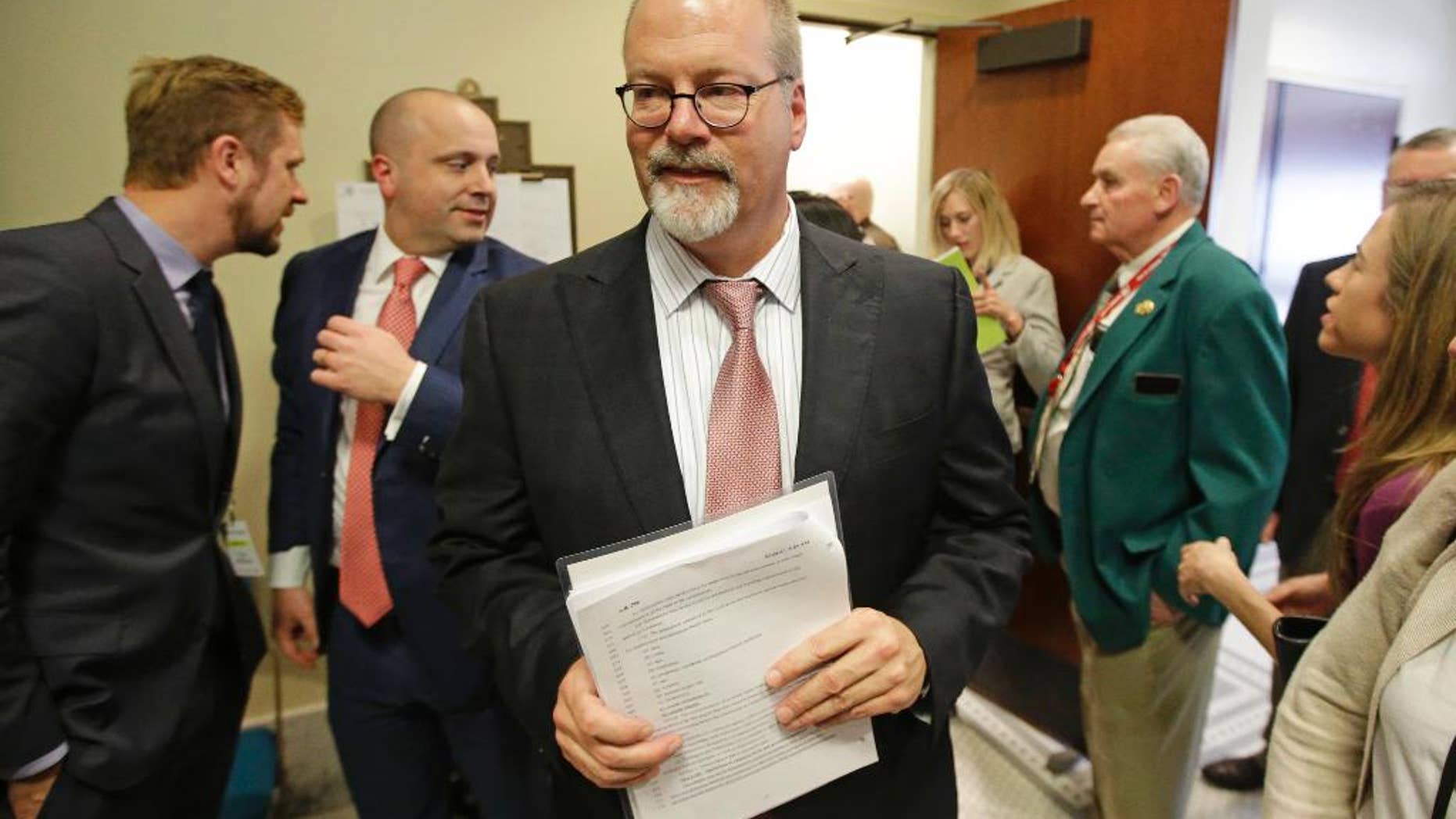 Sen. Stephen Urquhart, R-St. George, leaves a House committee hearing Tuesday, March 10, 2015, in Salt Lake City. An anti-discrimination bill protecting LGBT Utah residents and religious rights awaits a final vote by lawmakers. The bill was approved on Tuesday afternoon. It was originally scheduled for Monday, but postponed by the House Judiciary Committee after an hour-long hearing so that they could hear more comments from the public. (AP Photo/Rick Bowmer)