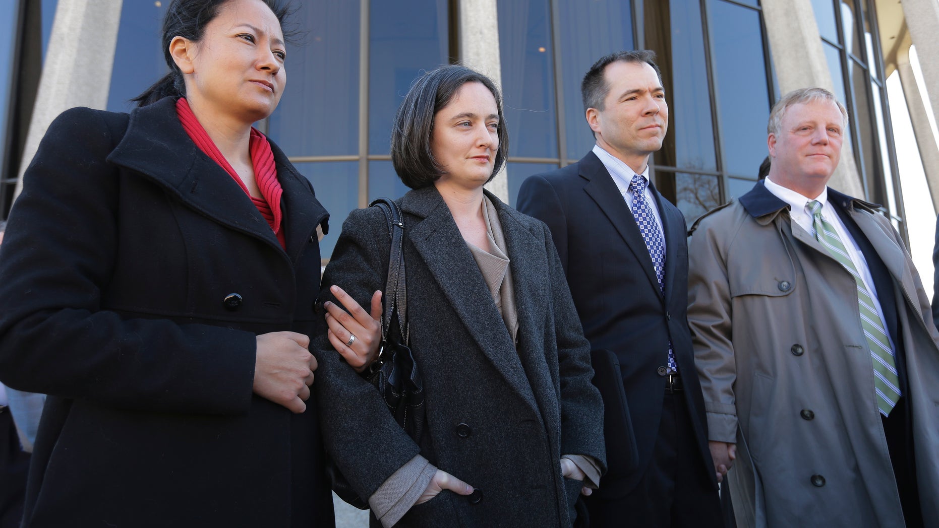 Feb. 14, 2014: The two homosexual couples who challenged Texas' ban on same-sex marriage, Cleopatra De Leon, left, and partner, Nicole Dimetman, second from left, and Victor Holmes and partner Mark Phariss, right, talk with media.