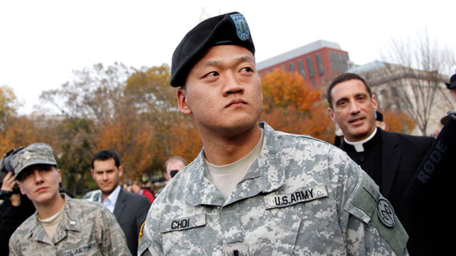 Nov. 15: Lt. Dan Choi, center, is seen in front of the White House in Washington, D.C., moments before he handcuffed himself to the fence of the White House during a protest for gay rights. (AP)