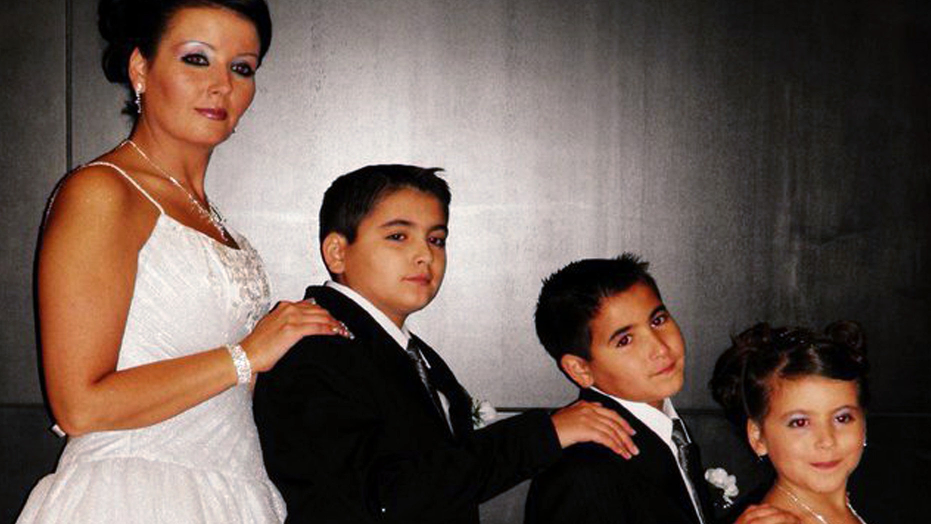 FILE: Bethany Gonzales poses with her three children, 13-year-old Jehed, 10-year-old, Edhem, and 9-year-old Jannah