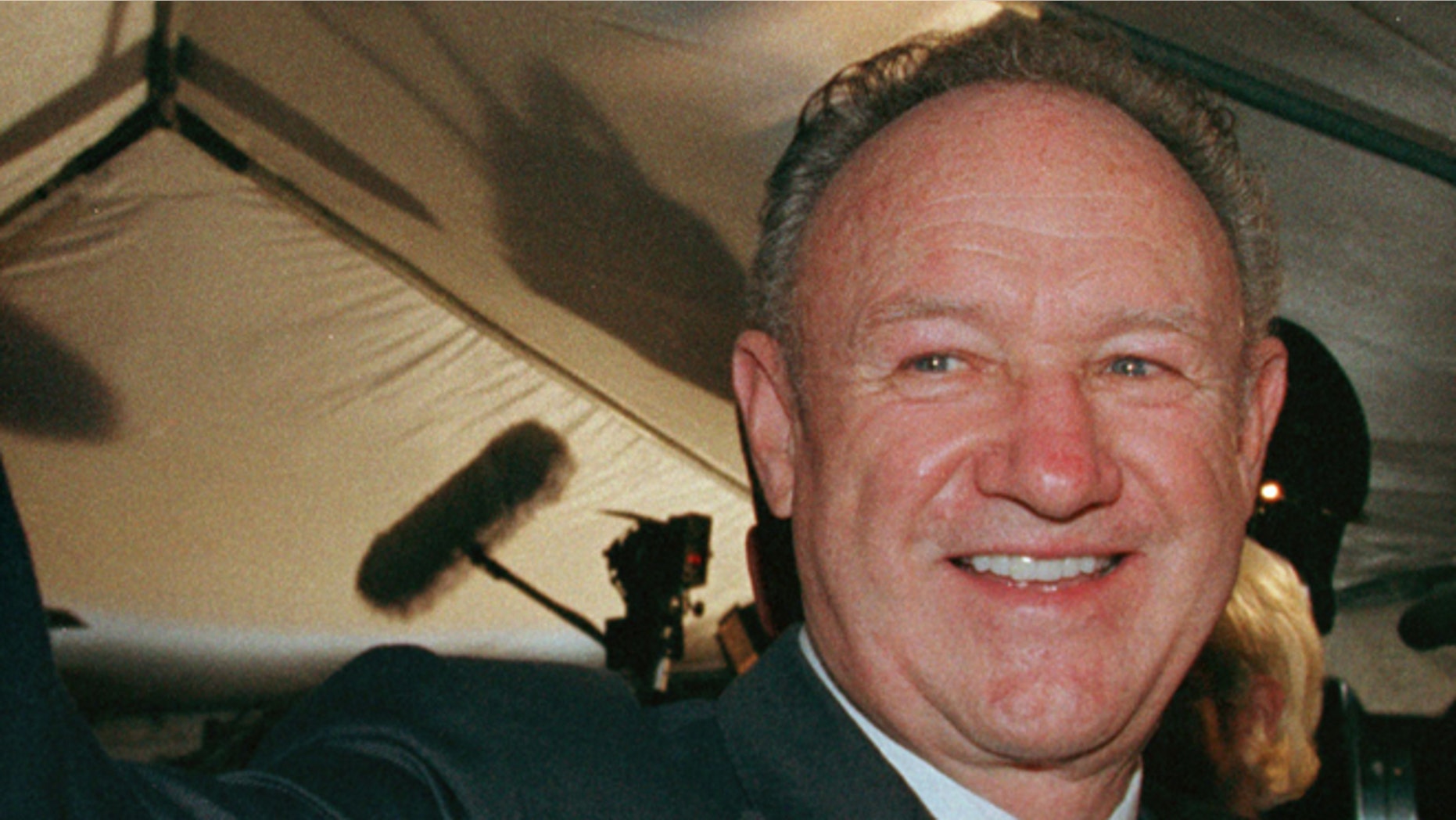 Actor Gene Hackman waves to fans prior to the premiere of the animated film "ANTZ" at the Toronto International Film Festival, September 19.