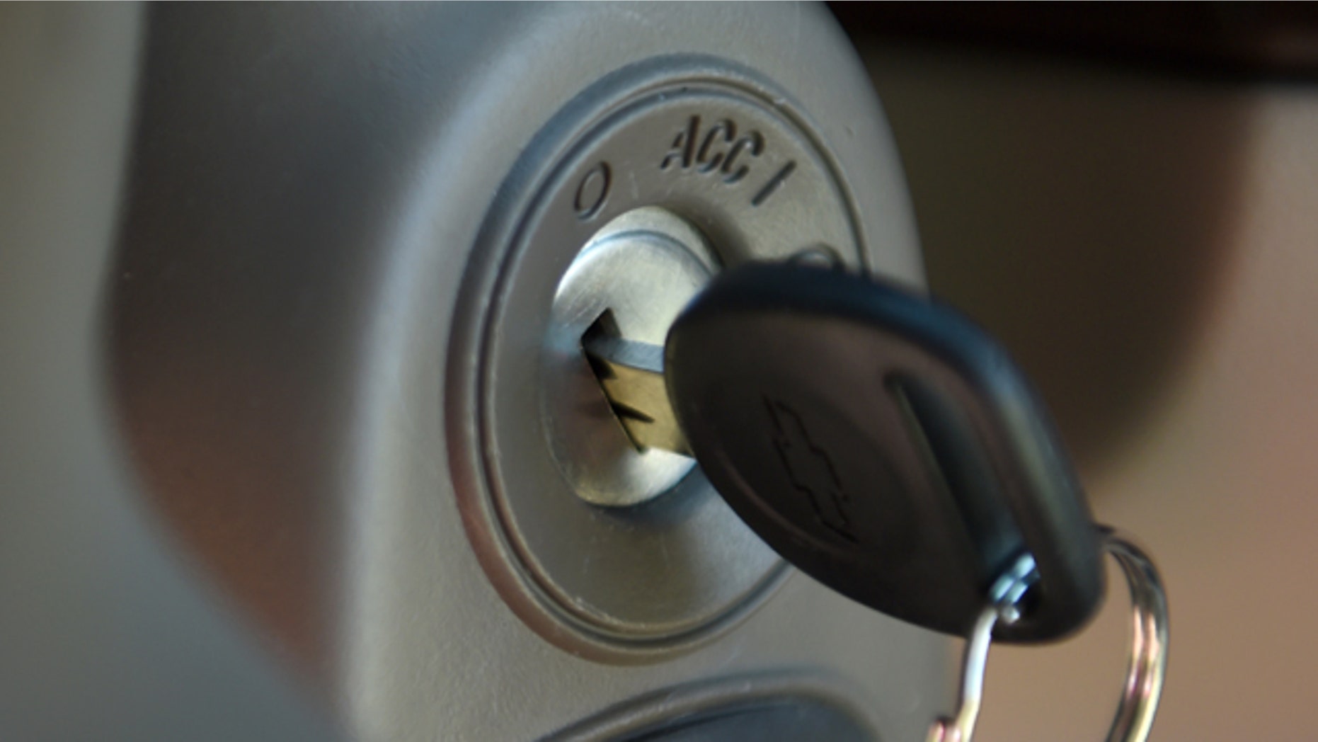 FILE - This Tuesday, April 1, 2014 file photo shows a key in the ignition switch of a 2005 Chevrolet Cobalt in Alexandria, Va. (AP Photo/Molly Riley, File)