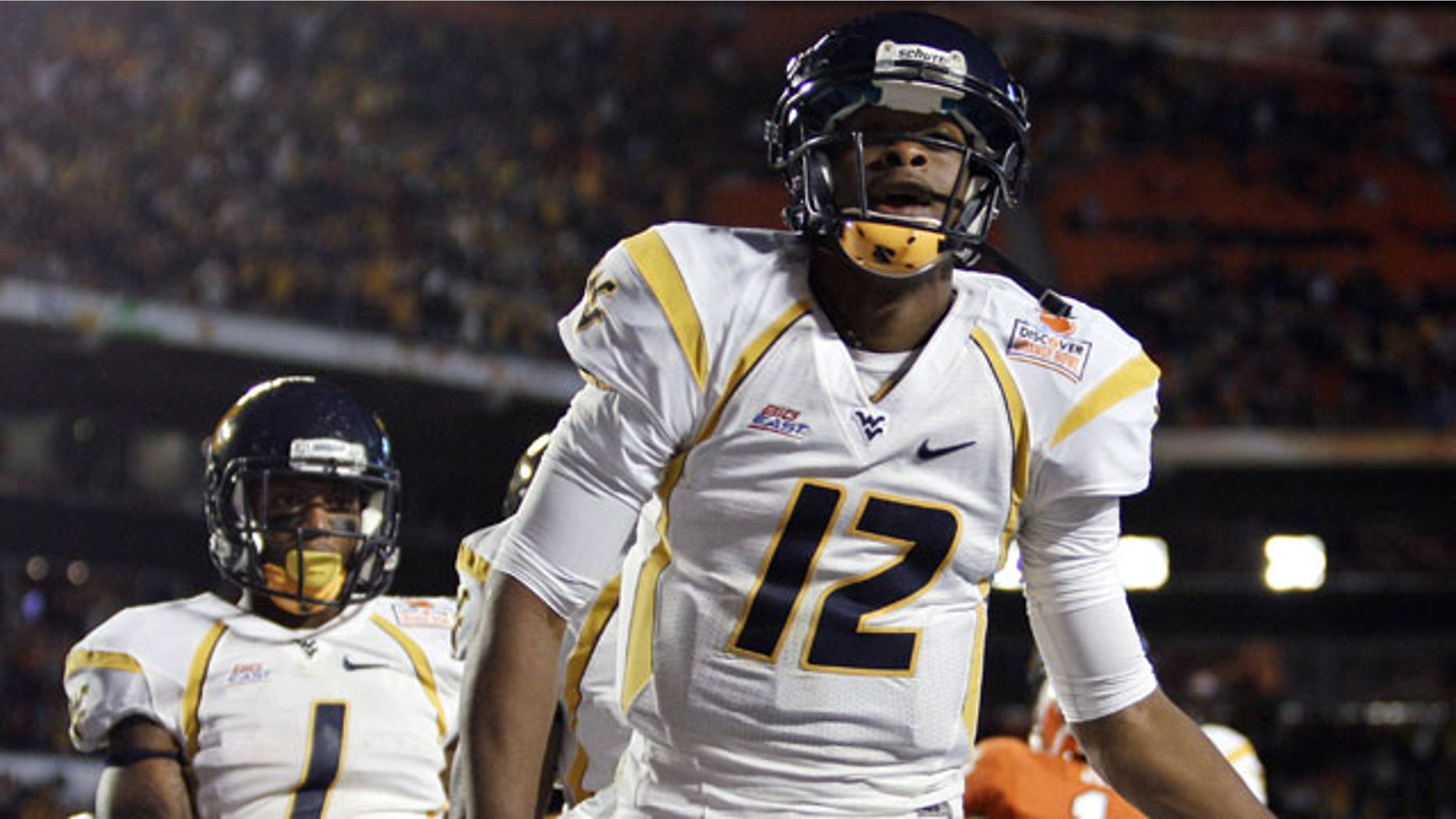 January 4, 2012: West Virginia quarterback Geno Smith celebrates a touchdown during the first half of the Orange Bowl NCAA college football game against Clemson in Miami.