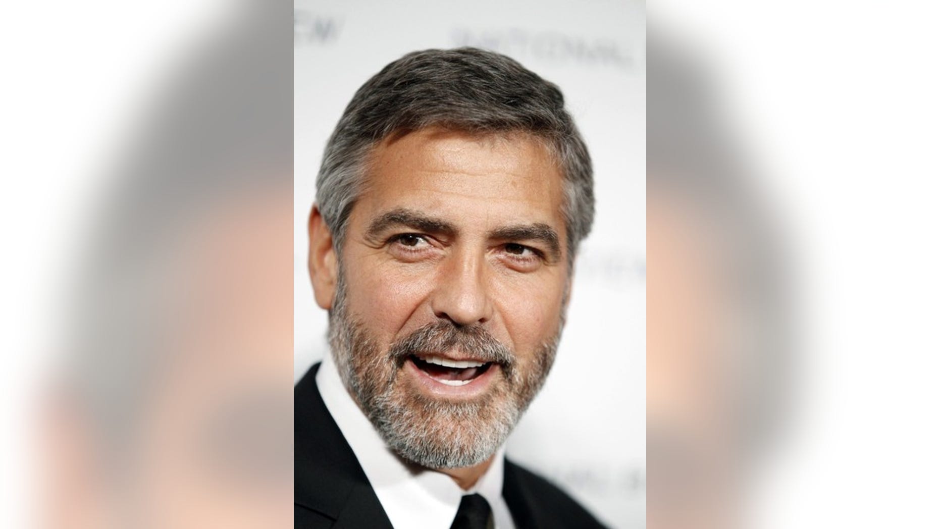 Actor George Clooney arrives to accept the award for Best Actor for his role in "Up In The Air" at the National Board of Review Award ceremony in New York in this January 12, 2010 file photo. Clooney was nominated for best actor for his role in the film "Up in the Air" for the 82nd Academy Awards, announced February 2, 2010. The Oscars will be presented in Hollywood March 7, 2010. REUTERS/Lucas Jackson/Files (UNITED STATES - Tags: ENTERTAINMENT HEADSHOT)