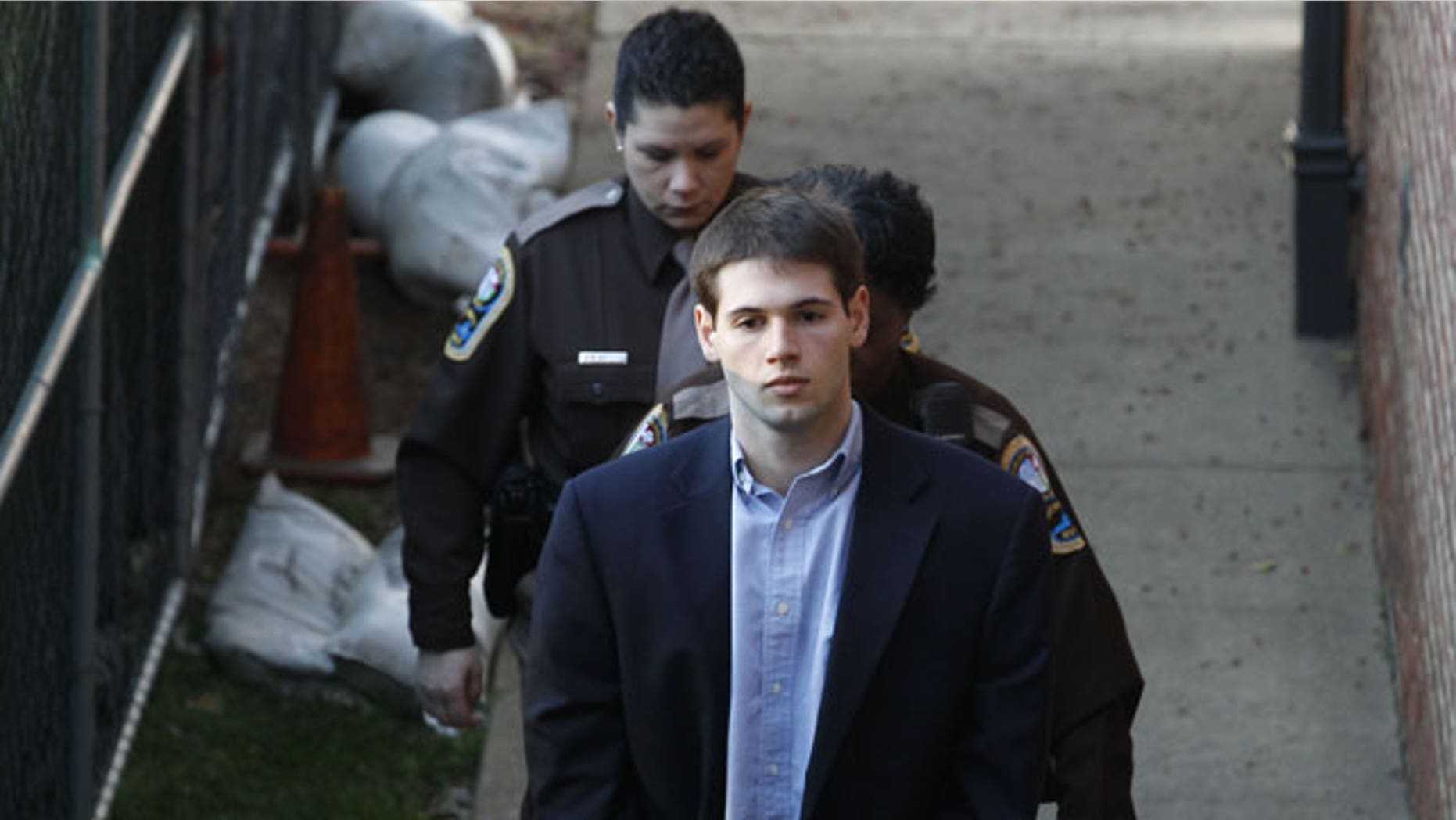 Feb. 9, 2012: George Huguely V is escorted to Charlottesville Circuit Court by members of the Charlottesville Sheriff's Office for the start of his trial in Charlottesville, Va.