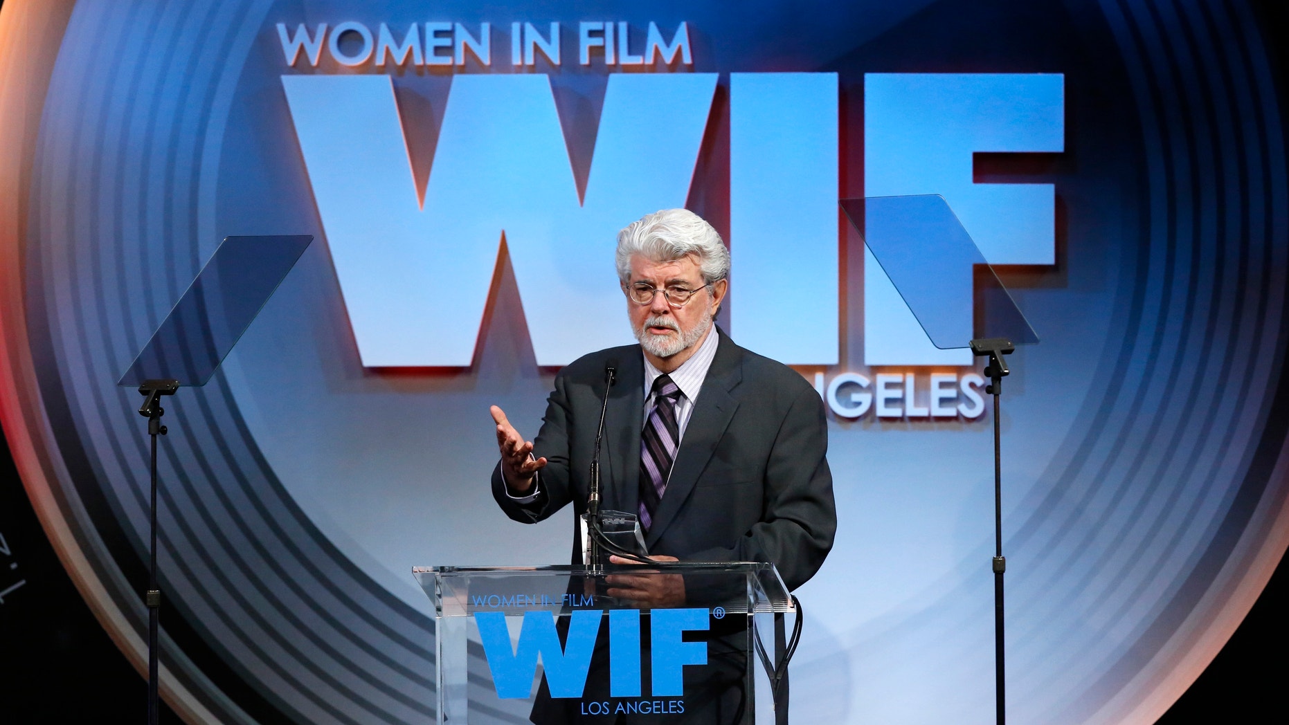 Director and producer George Lucas accepts the Norma Zarky Humanitarian award at the Women In Film Los Angeles 2013 Crystal and Lucy Awards in Beverly Hills, California June 12, 2013.
