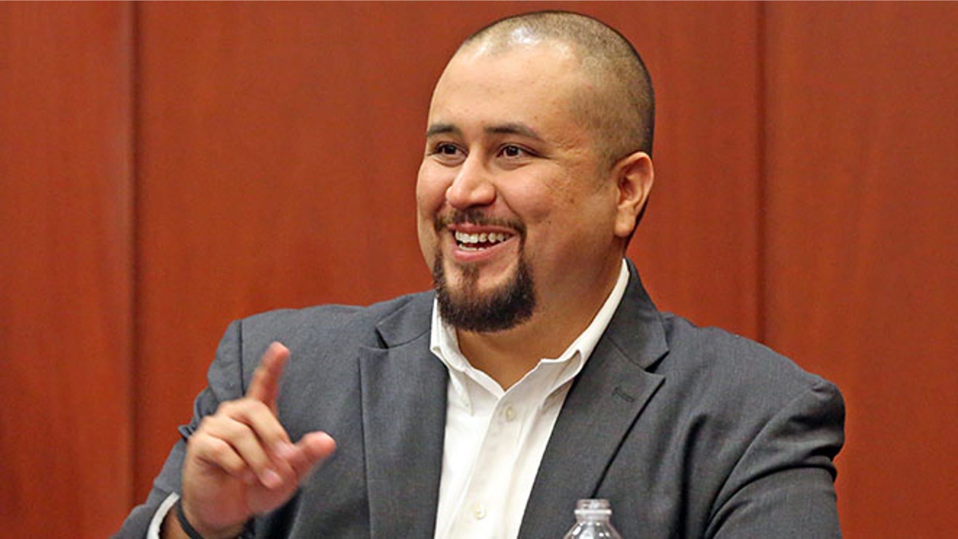 Zimmerman smiles as he testifies in a Seminole County courtroom Tuesday, Sept. 13, 2016 in Orlando, Fla.