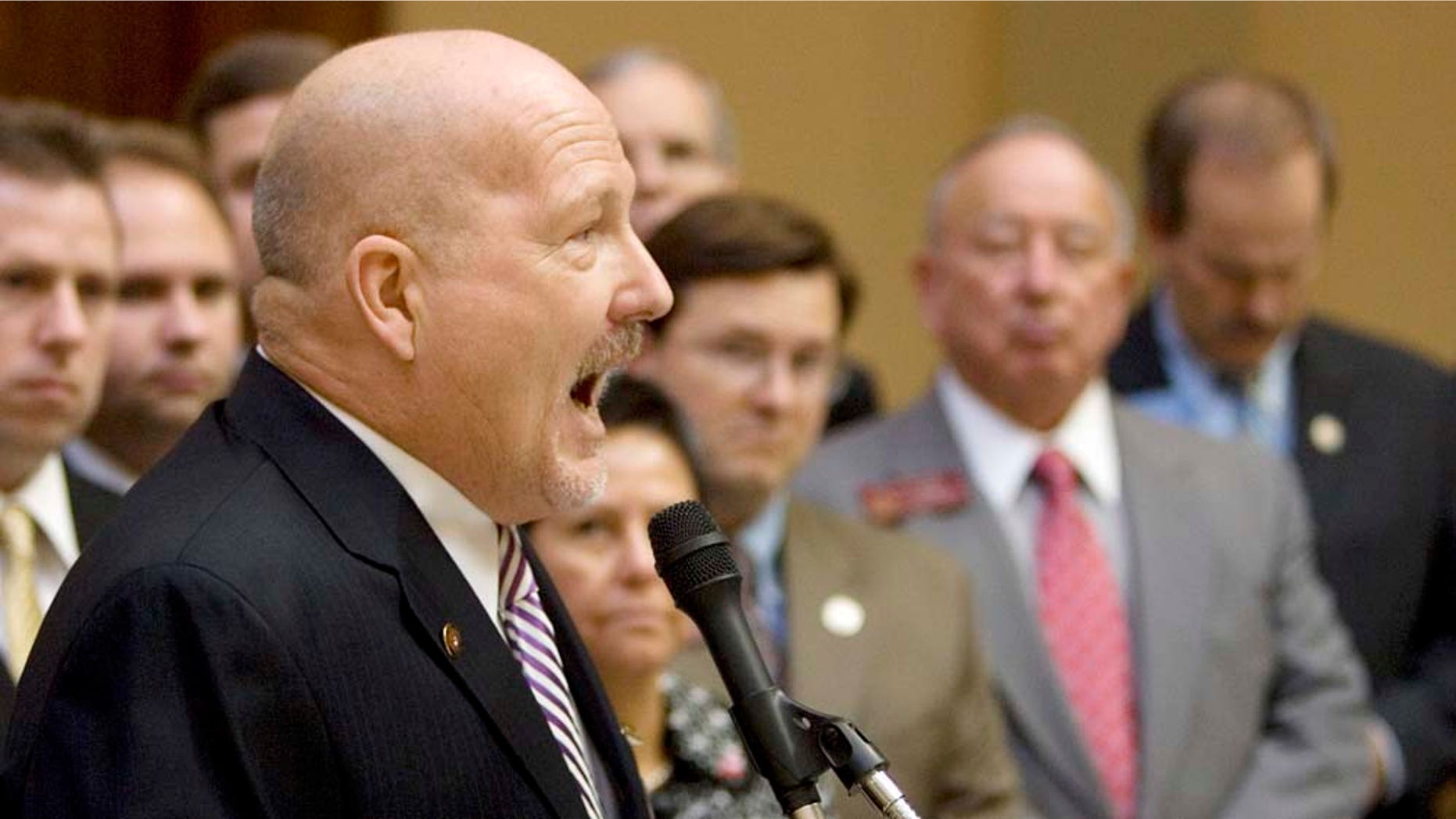 FILE - In a Jan 12, 2009 file photo, D.A. King, head of the Dustin Inman Society, speaks during a news conference as several members of the Georgia General Assembly look on at the Capitol in Atlanta. For nearly a decade, King has pushed for stricter enforcement of immigration laws. With a sometimes confrontational approach, he’s won a lot of supporters but also a lot of enemies. (AP Photo/John Bazemore, File)