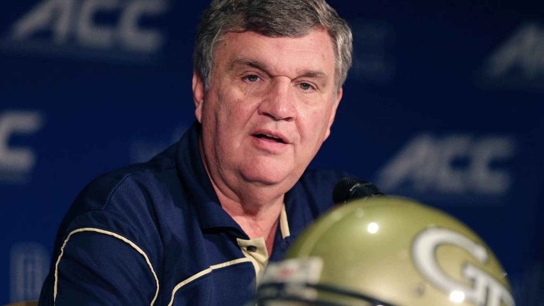 FILE - In this July 21, 2014, file photo, Georgia Tech head coach Paul Johnson answers a question during a news conference at the Atlantic Coast Conference Football kickoff in Greensboro, N.C. Johnson points to a string of high finishes in the ACC's Coastal Division as proof criticism of his program is unwarranted. Still, the Yellow Jackets enter 2014 looking to improve on back-to-back seven-win finishes, to finish in the Top 25 for the first time since 2009 and to end a streak of five straight losses to state rival Georgia. (AP Photo/Chuck Burton, File)