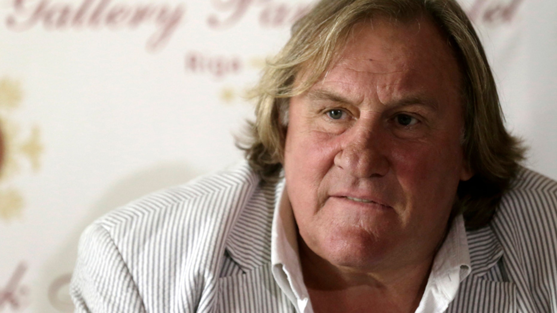 French actor Gerard Depardieu listens during a news conference in Riga August 28, 2014.