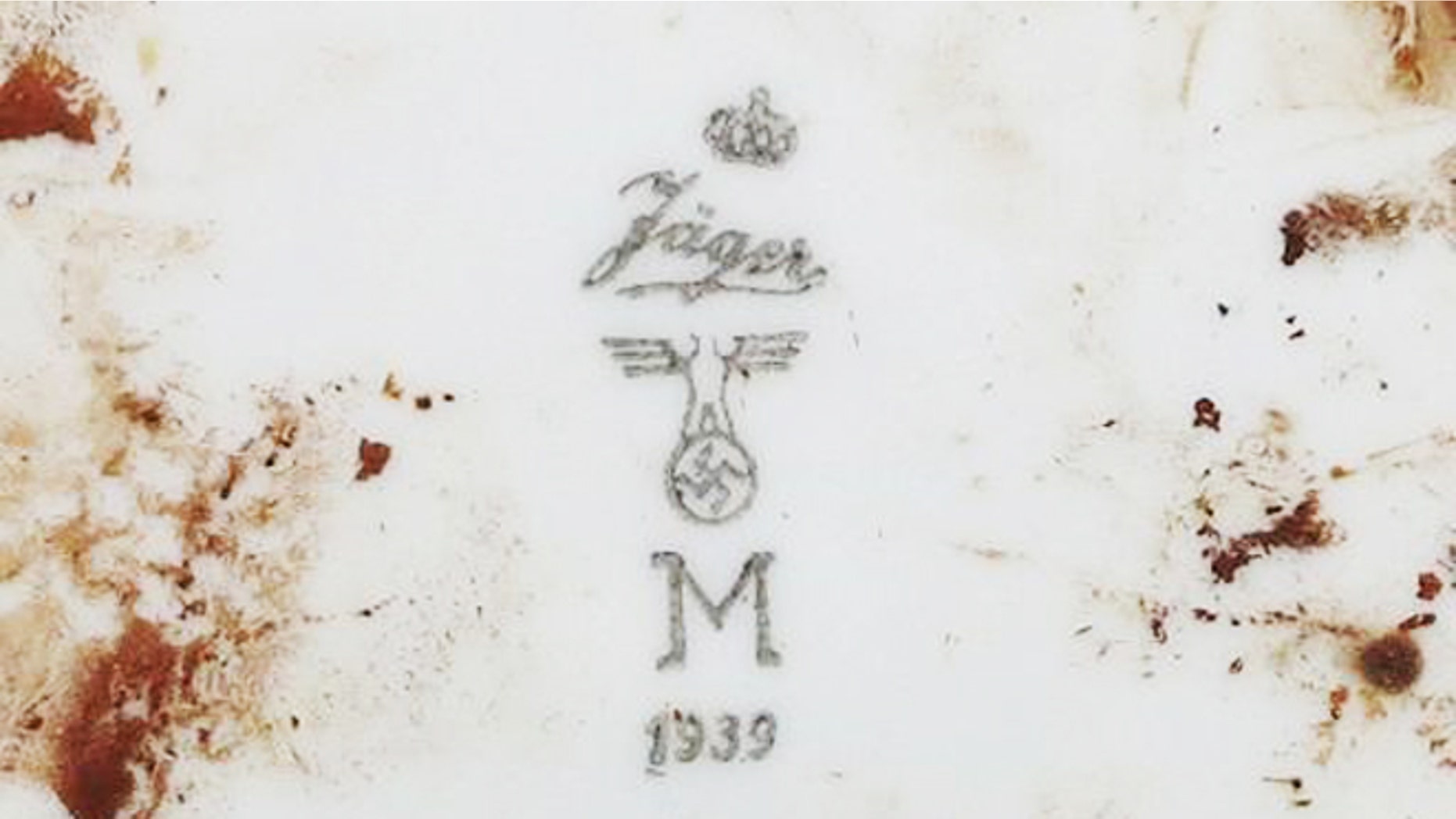 Nov. 21, 2013: Markings on a plate found by Indonesian archaeologists at the site of a sunken German submarine from the World War II era.