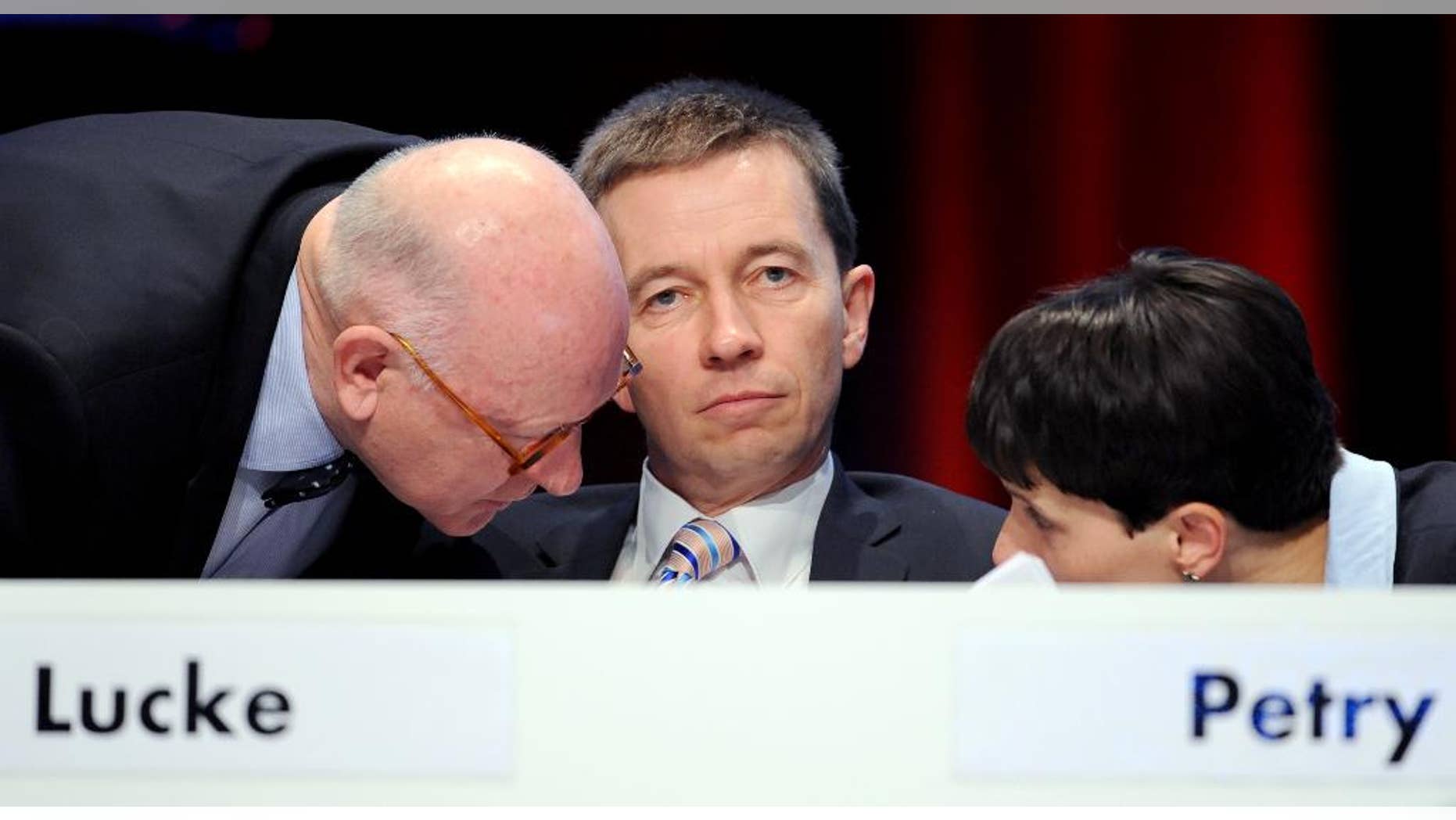 FILE - In this Feb. 1, 2015 file picture members of the board of AfD party (Alternative for Germany) from left: Michael Muster, Bernd Lucke, and Frauke Petry attend a party convention in Bremen, Germany. The upstart German party called off a planned congress amid increasingly infighting over its leadership and future course. Party spokesman Christian Lueth said Tuesday June 2, 2015 that the leadership decided to call off a congress planned for June 13-14 because of "legal concerns. ( Ingo Wagner/dpa via AP,file)
